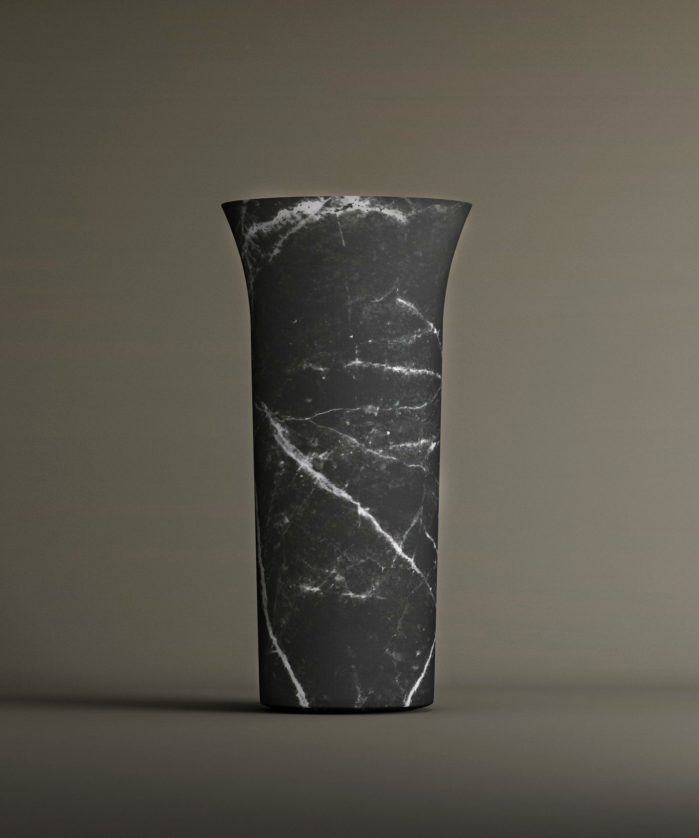 The TRAVERTABLE Nero Marquina Marble Cylinder Pedestal Vanity Sink features dramatic white veining and a flared rim, making it ideal for sculptural impact in design-forward bathrooms.