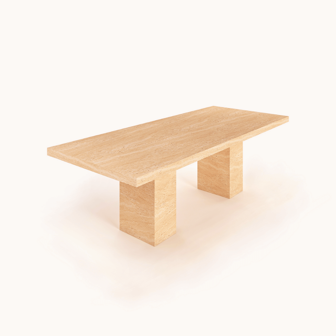 The Grand Travertine Dining Table by Travertable is a minimalist piece featuring a rectangular top and two substantial rectangular legs. Its light natural wood finish exudes sleek elegance, embodying modern design for a clean, contemporary look.