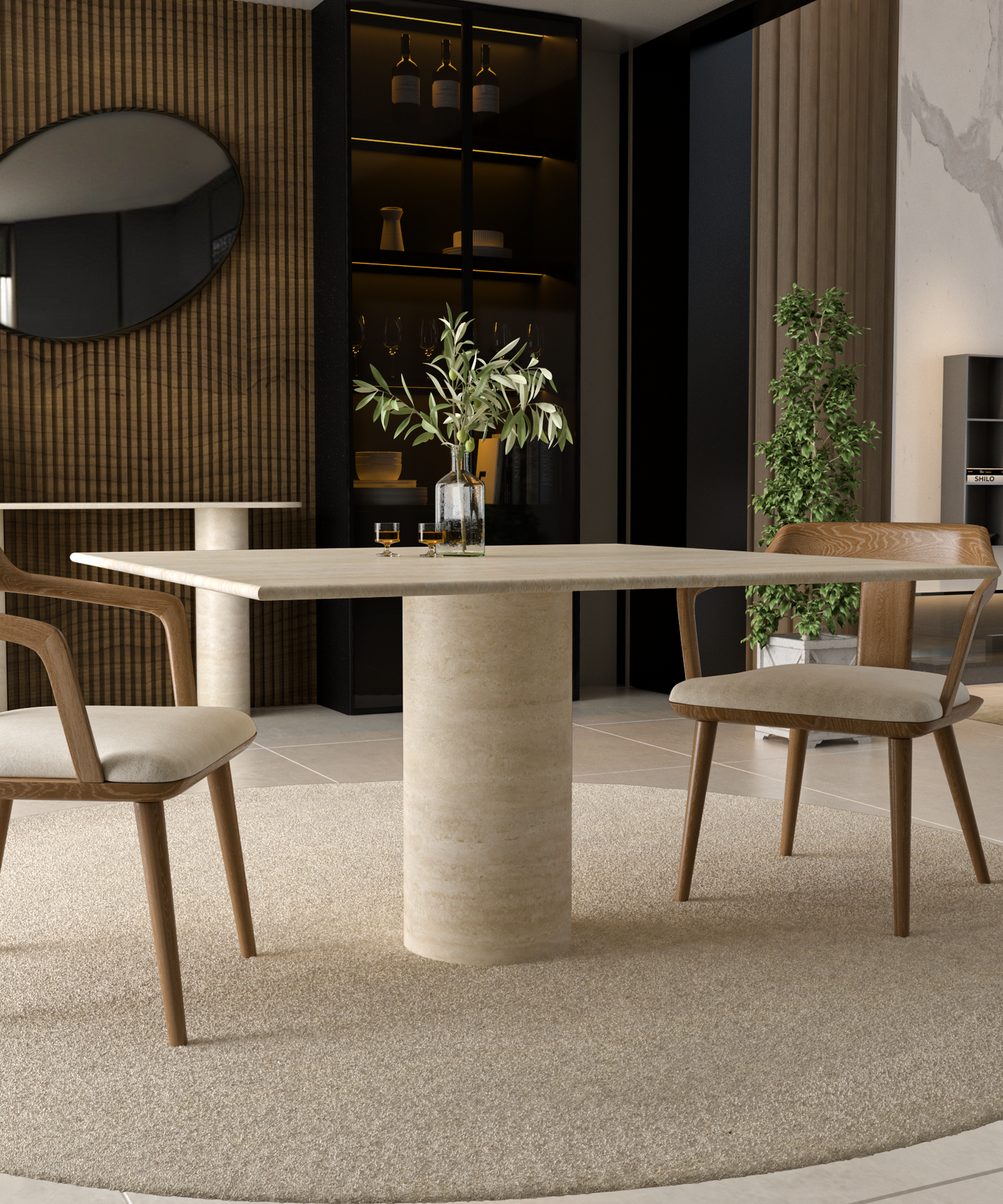 A modern dining room showcases the TRAVERTABLE Square Travertine Dining Table with Cylindrical Center Base, two cushioned wooden chairs, a vase with green branches, carpeted floor, glassware shelves, wall mirror, and a tall plant.