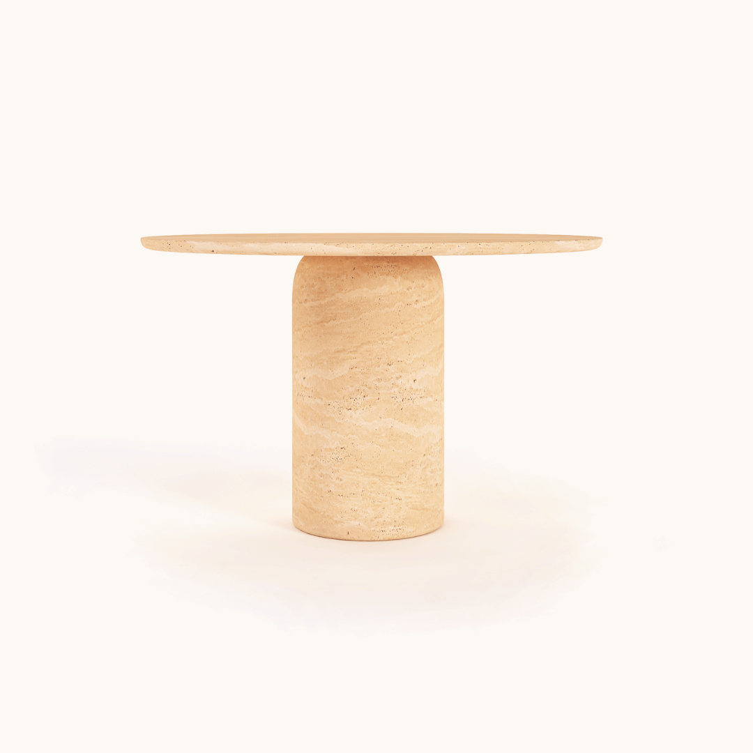 A beige natural-textured Chic Oval Travertine Dining Table by Travertable, featuring a smooth marble surface and cylindrical base, is set against a white background.