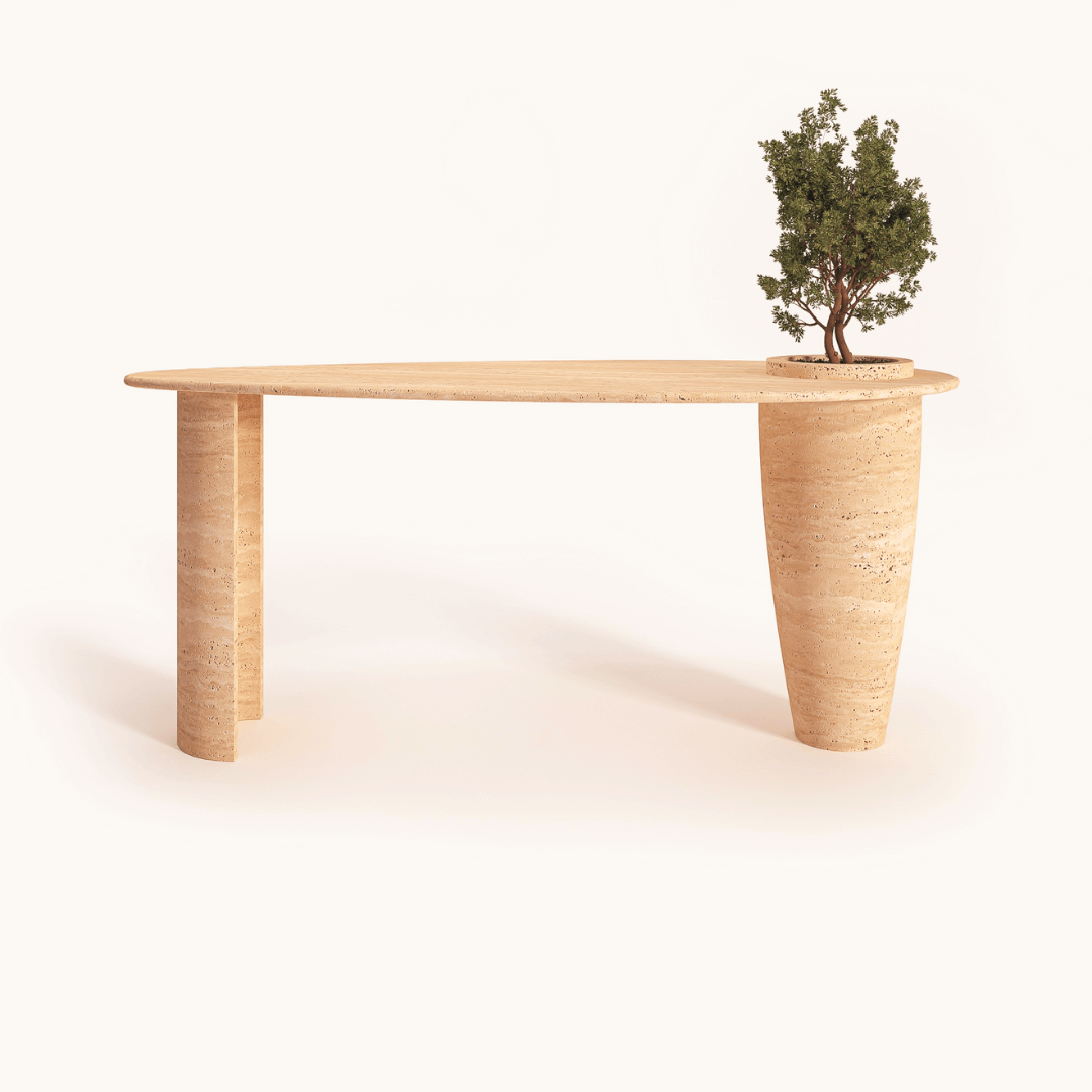 The Travertable Versatile Travertine Office and Dining Table features a beige travertine top, two cylindrical legs, a built-in vase design with a small potted tree, and minimalist charm. Ideal for modern settings, its functionality seamlessly integrates into both office and dining environments.
