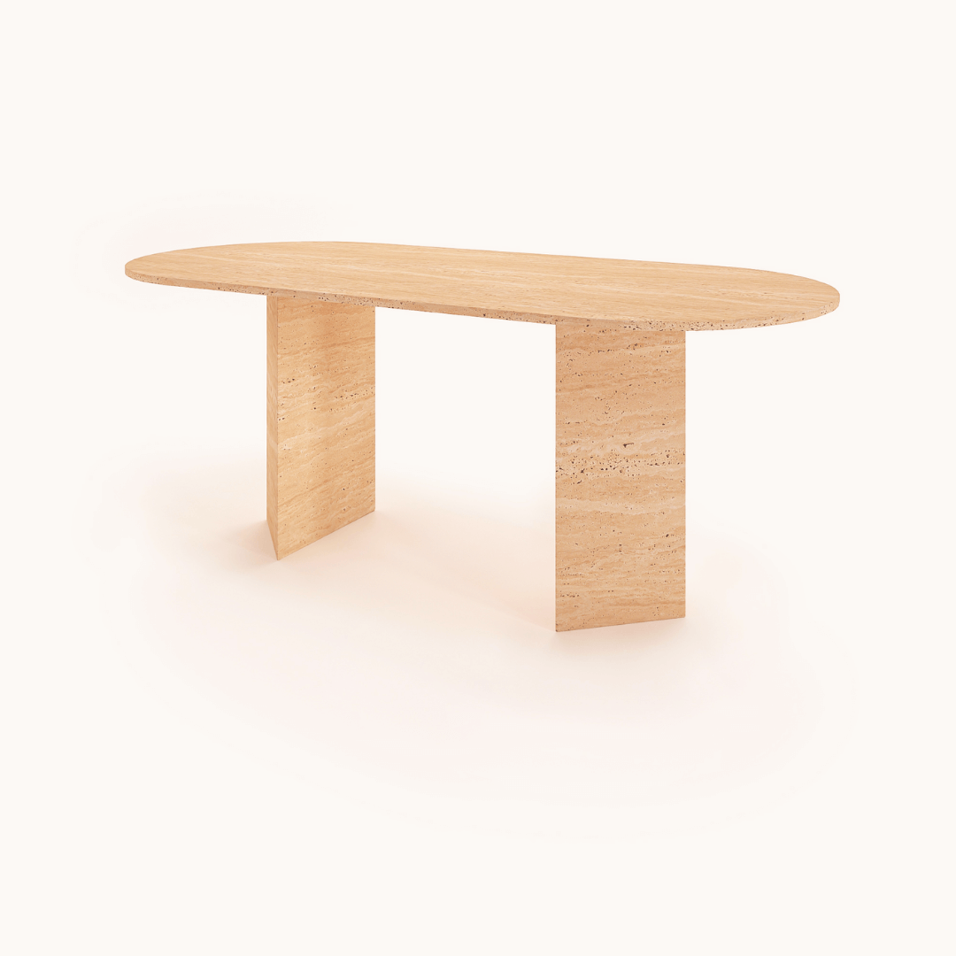 The Grand Pillar Travertine Dining and Meeting Table by Travertable features an oval top with two rectangular block legs in a modern design, crafted from light wood, all set against a plain white background.