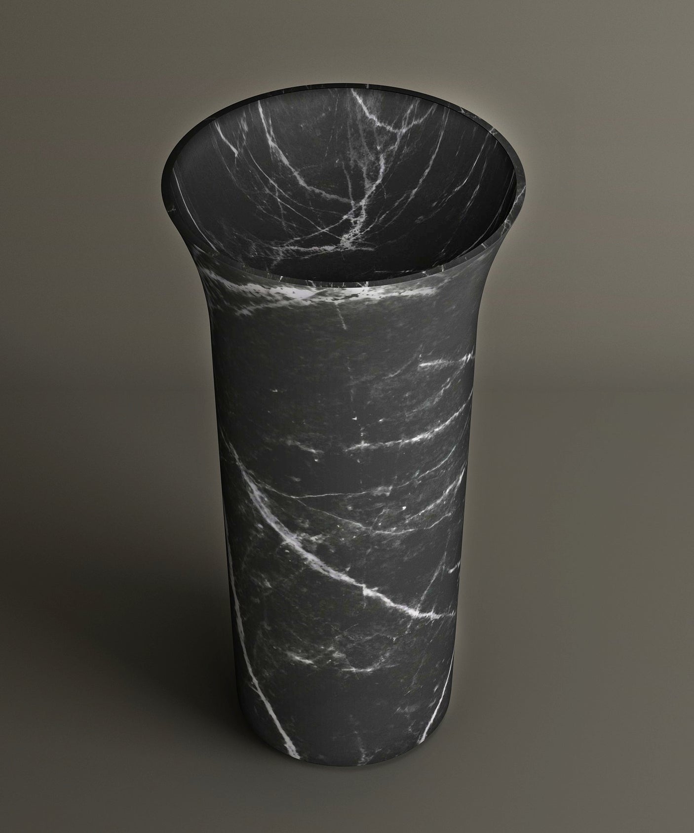 The TRAVERTABLE Nero Marquina Marble Cylinder Pedestal Vanity Sink features striking white veining and a sculptural silhouette, making a bold statement against any neutral backdrop.