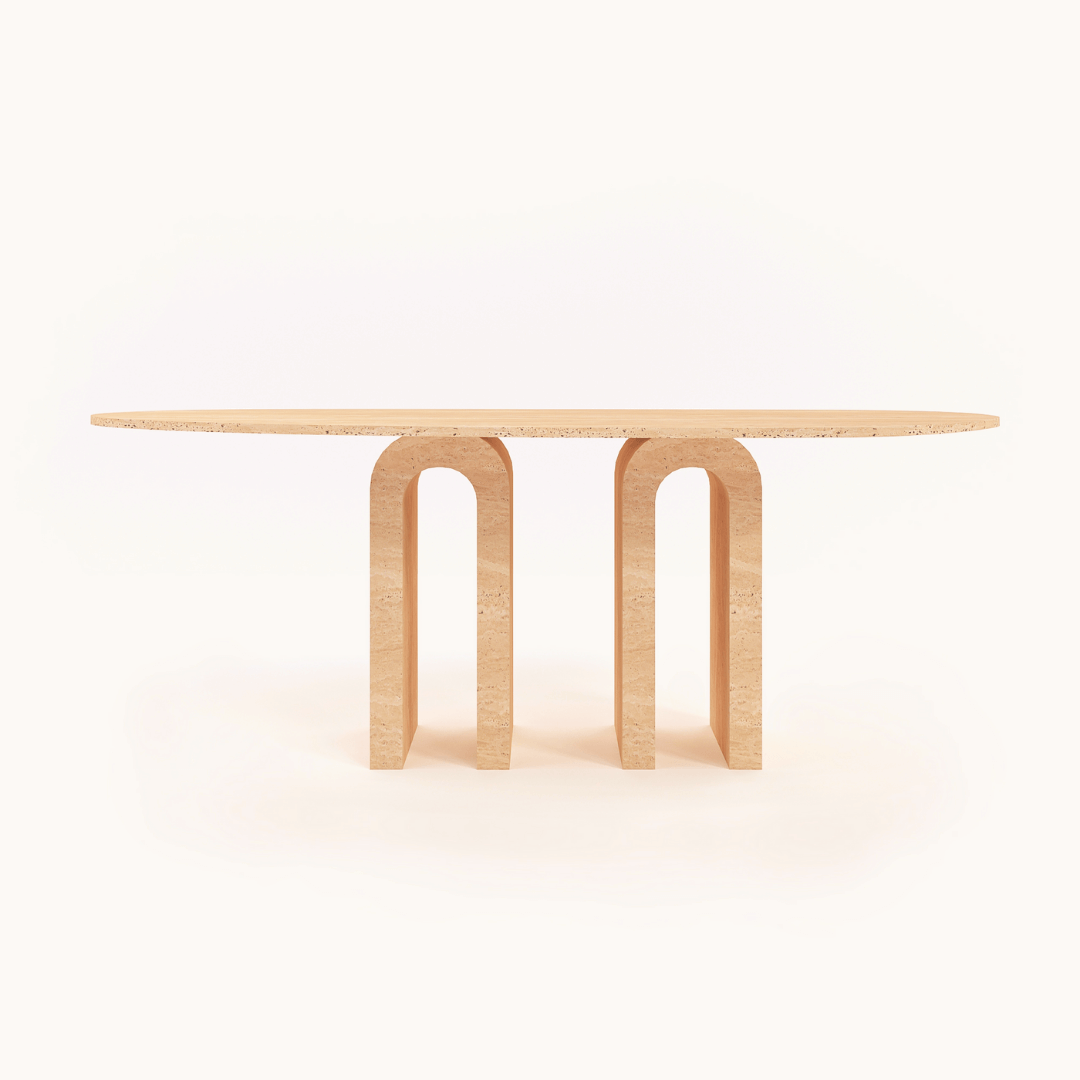 The Travertable Luxurious Oval Travertine Dining Table features a chic and contemporary design with a smooth oval top and dual U-shaped columns, set against a white background.