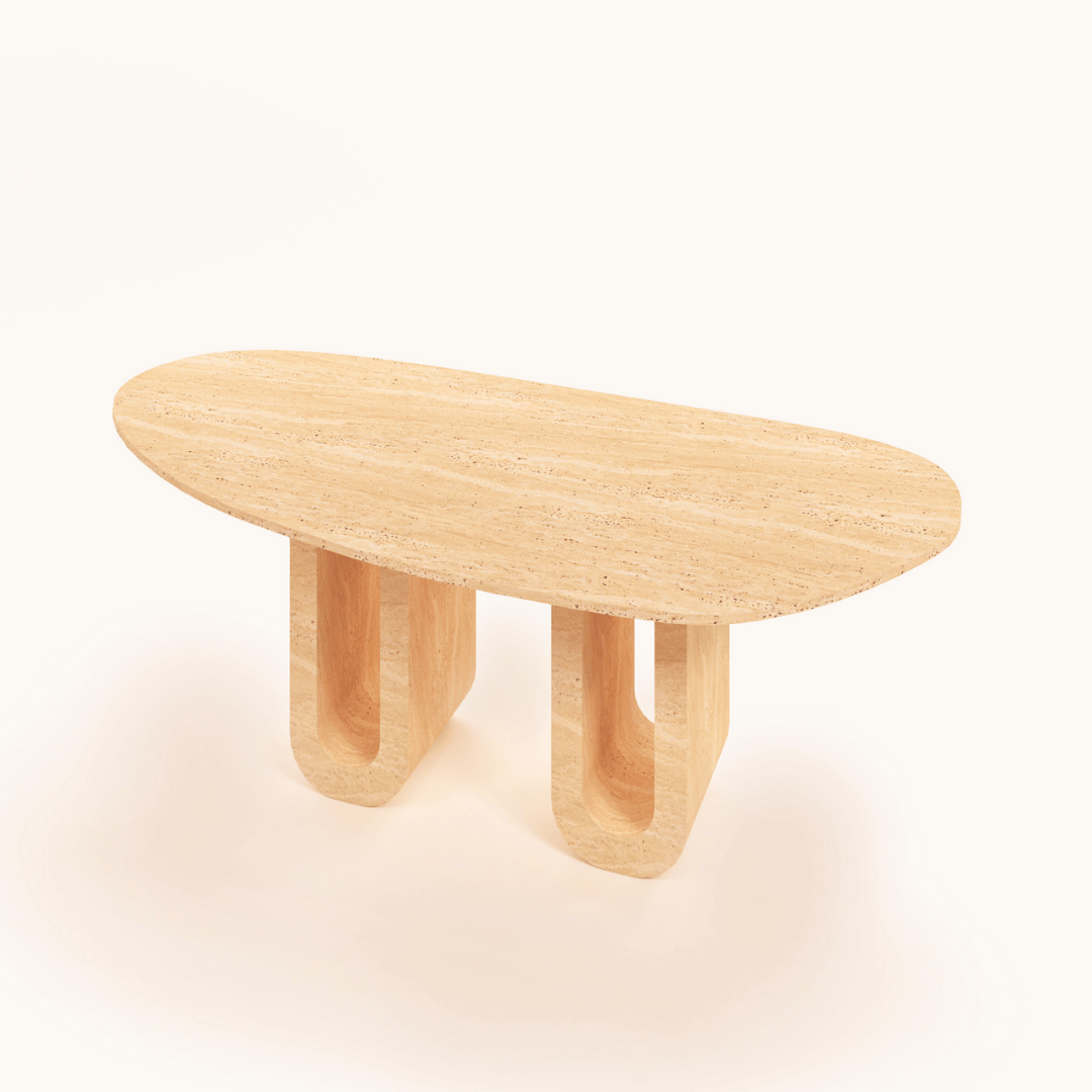 The Luxurious Oval Travertine Dining Table by Travertable boasts a light natural finish with two uniquely designed U-shaped legs. Its smooth texture and refined presence shine against a white background.