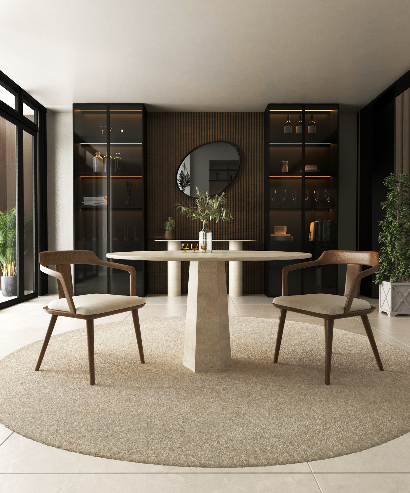 A modern dining room features the TRAVERTABLE Oval Travertine Dining Table with Rockcone Center Base, two wooden chairs, a circular rug, built-in glass cabinets, a round mirror, and decorative items on a wood-paneled wall.