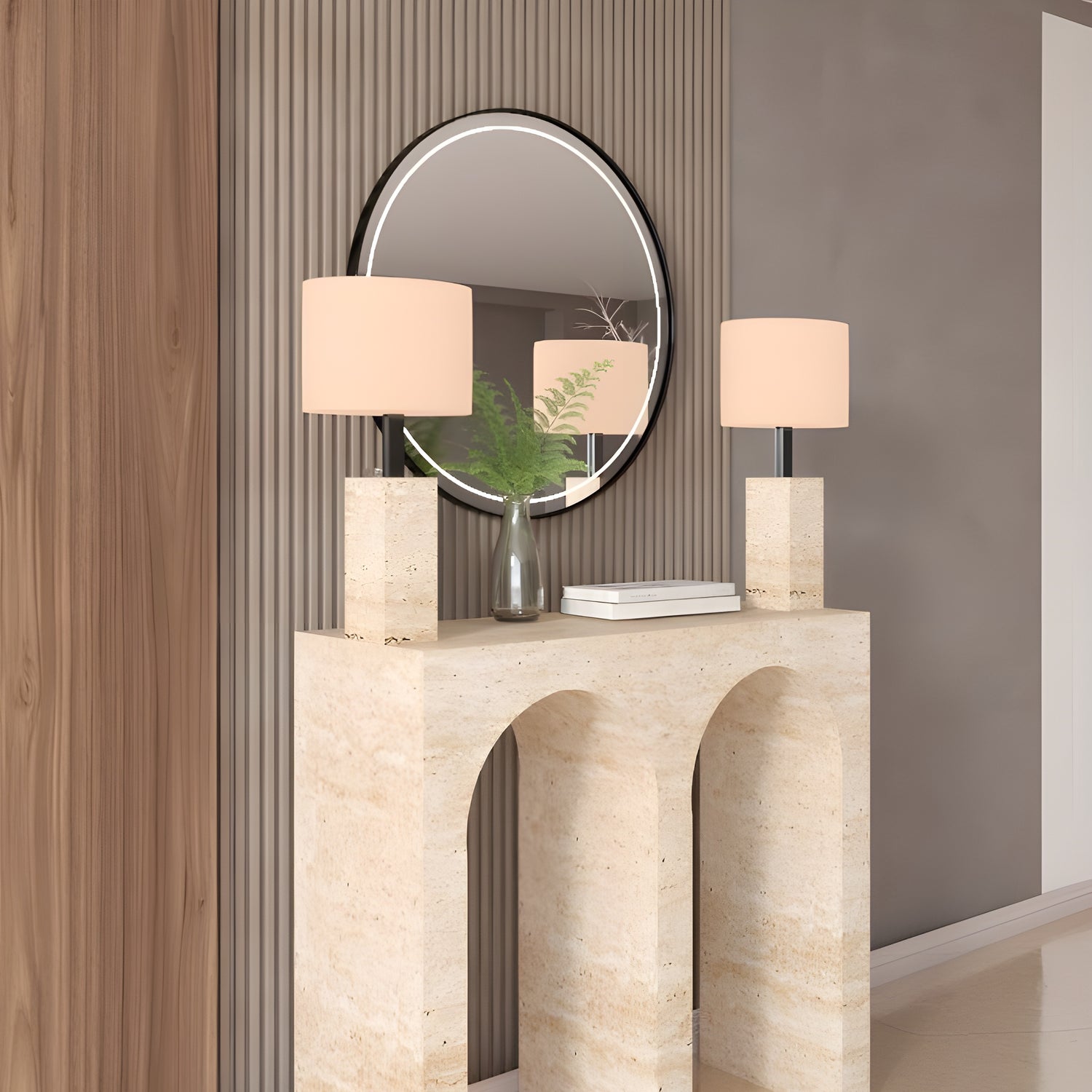 The TRAVERTABLE Travertine Console Table with Two Arches brings modern style to your space, topped with square-based lamps and accented by a round mirror and a glass vase with greenery for a refined statement look.