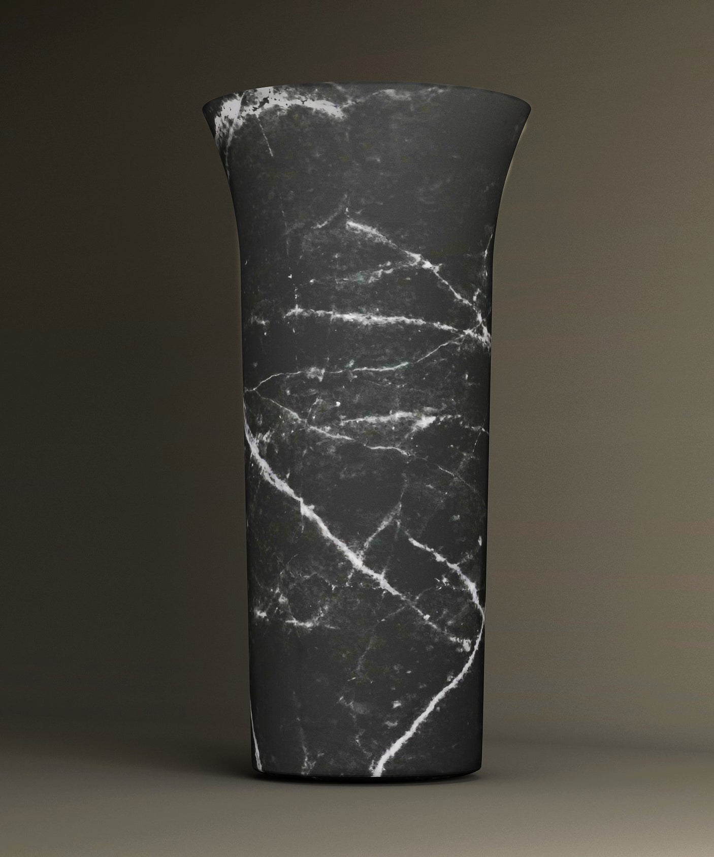 The Nero Marquina Marble Cylinder Pedestal Vanity Sink by TRAVERTABLE features a tall, matte black finish with striking white veining, creating a sculptural statement piece when set against a neutral brown background.