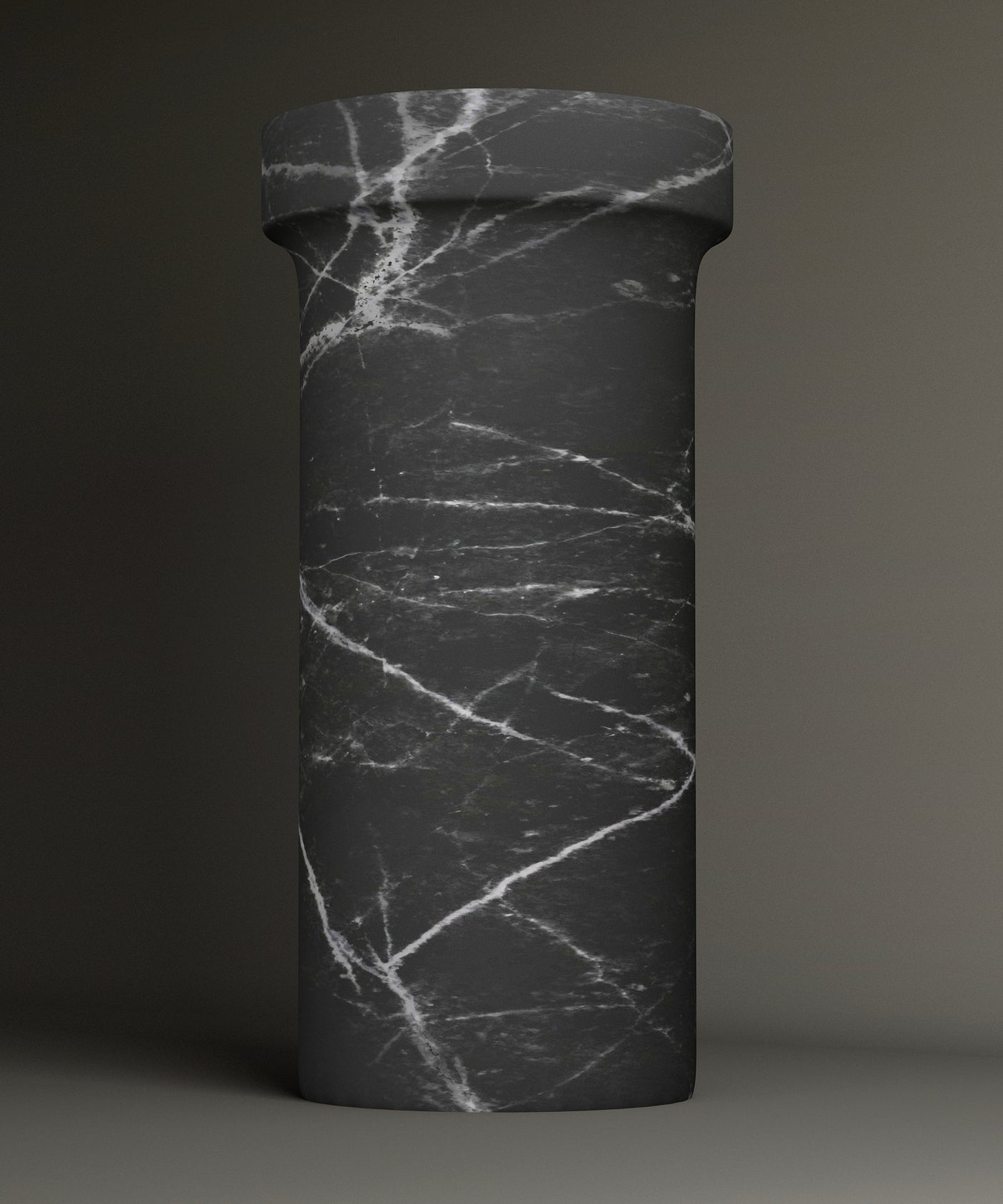 The TRAVERTABLE Nero Marquina Marble Pedestal Vanity Sink features a tall, cylindrical design with bold white veining and a wide, flat top—an elegant statement piece for modern interiors.
