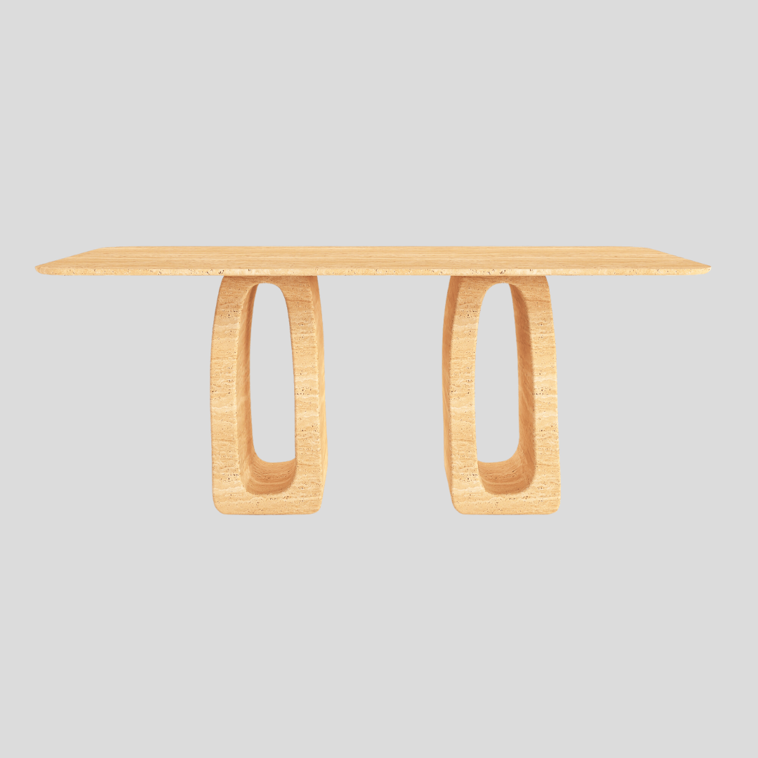 The Arcadia Travertine Dining Table by Travertable boasts a smooth top and two oval, hollow legs against a light gray backdrop. Its modern design is artistic and minimalist, seamlessly merging symmetry with elegance.