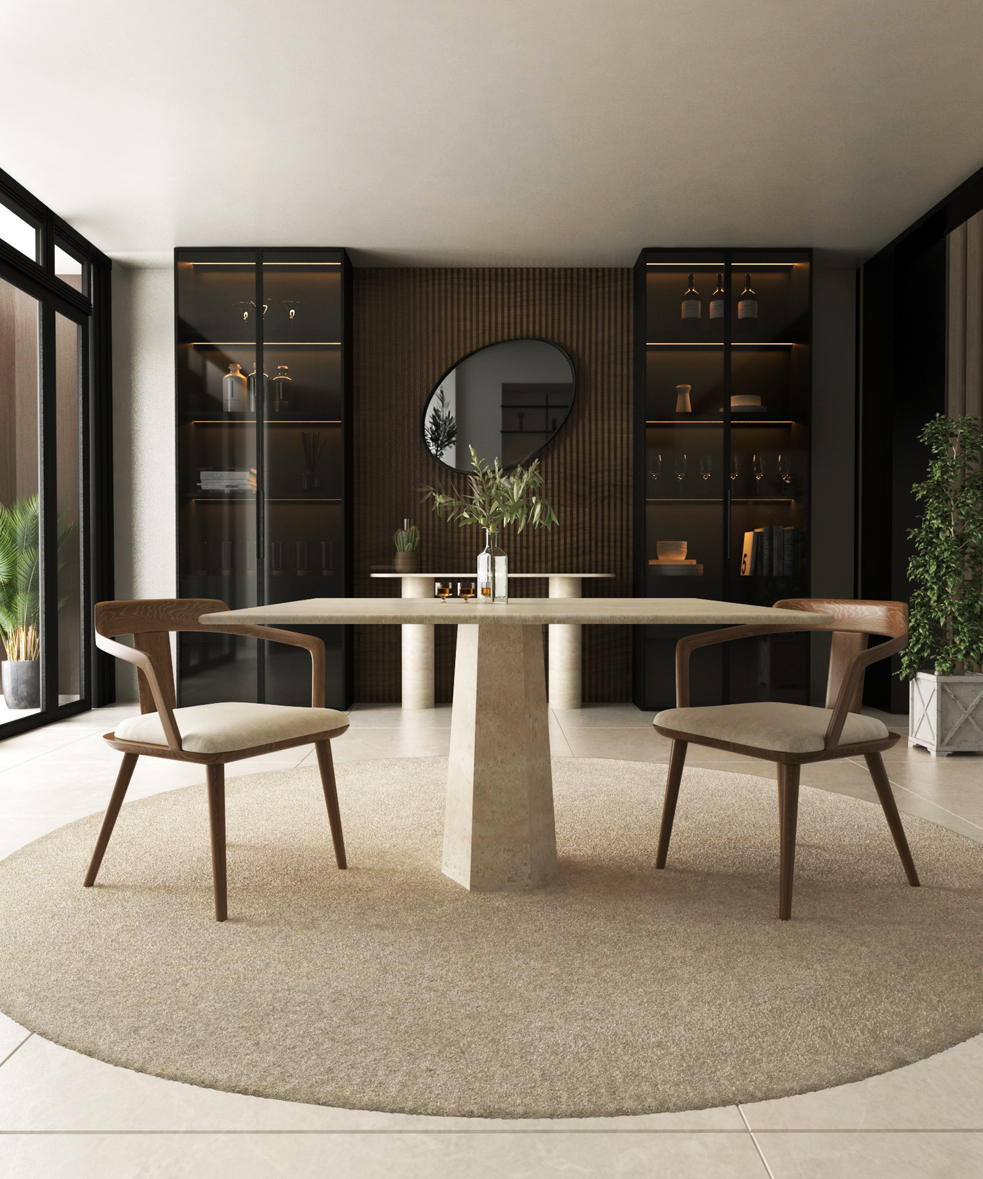 A modern dining room features the TRAVERTABLE Square Travertine Dining Table with Rockcone center base, two wooden chairs on a beige rug, built-in shelves, decor, a round mirror on the back wall, large windows, and indoor plants for natural light.