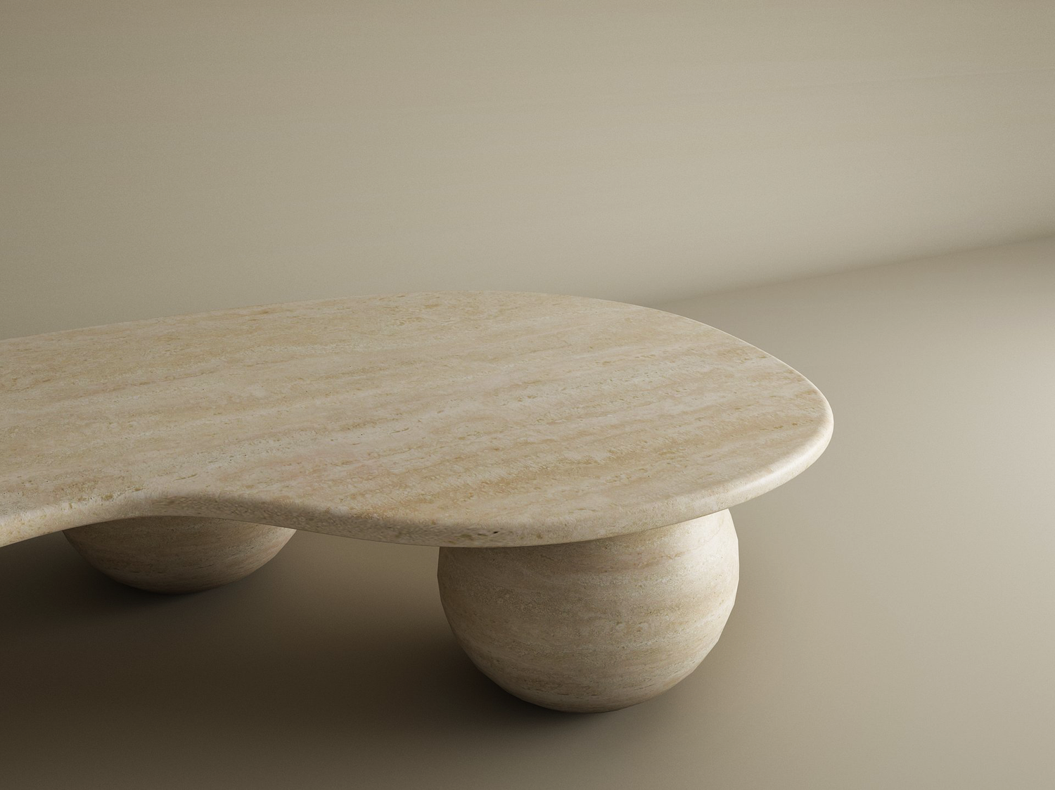 The TRAVERTABLE Wavy Travertine Coffee Table with Stone Ball Base, an organic sculptural piece with a marbled texture in warm neutral tones, adds elegance and soft shadows to a minimalist beige room. Customizable for your space.