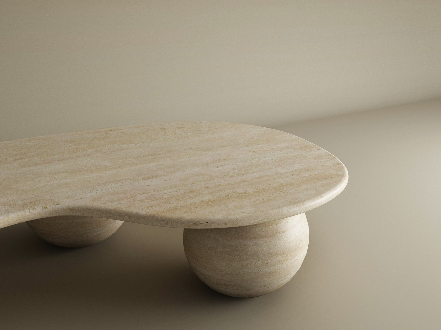 The TRAVERTABLE Wavy Travertine Coffee Table with Stone Ball Base, an organic sculptural piece with a marbled texture in warm neutral tones, adds elegance and soft shadows to a minimalist beige room. Customizable for your space.