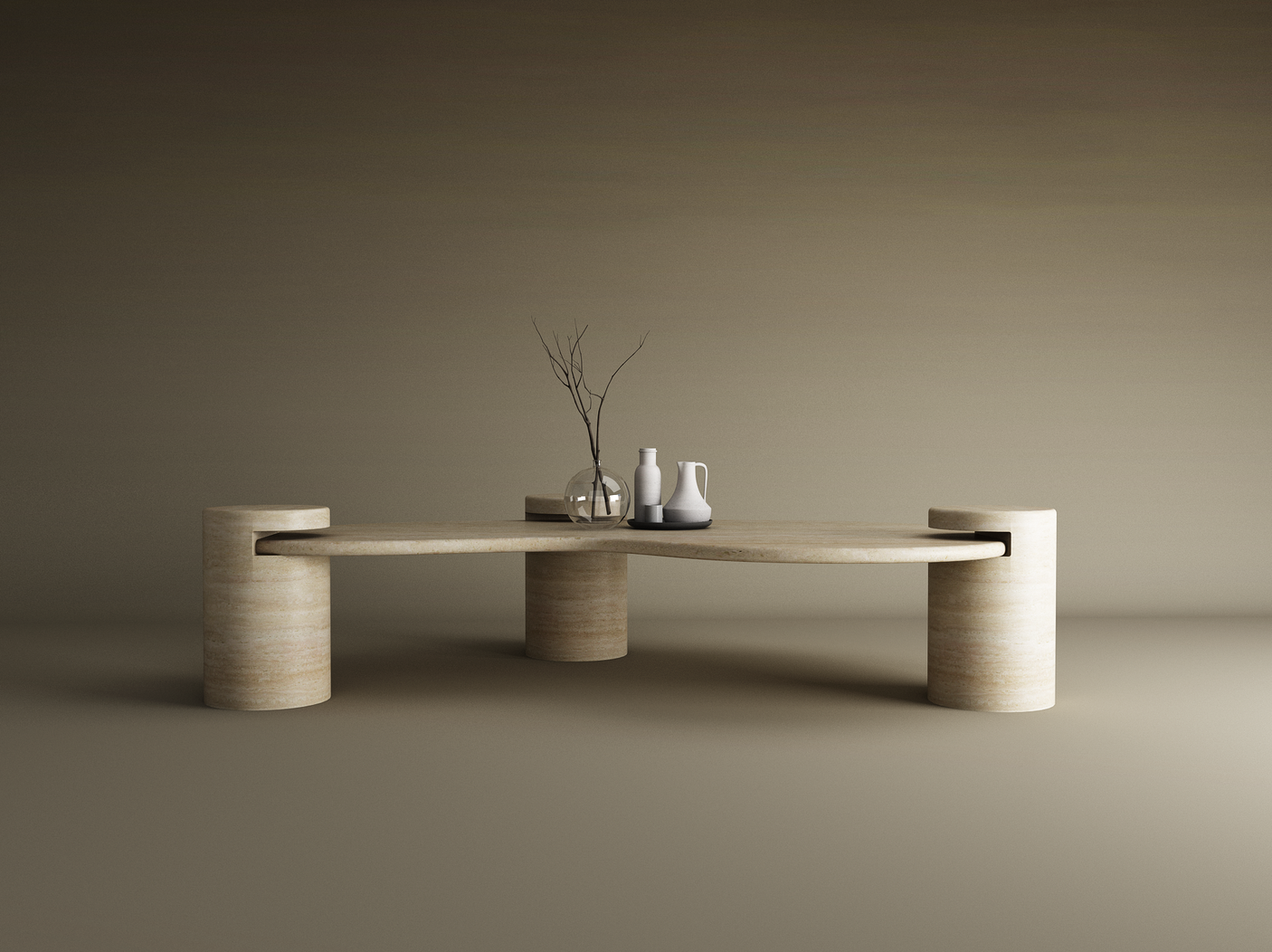 The Wavy Travertine Coffee Table with Cylindrical Base by TRAVERTABLE features sculptural curves and three legs, topped with a round glass vase of bare branches, a white pitcher, and a light gray vase against a brown gradient background.