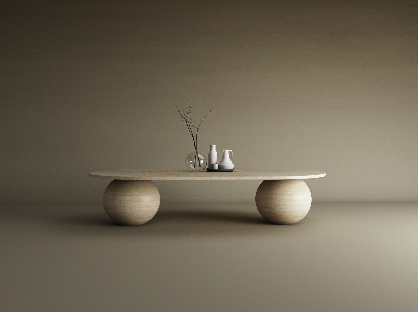 The TRAVERTABLE Oval Travertine Coffee Table with Stone Ball Base – Artistic Travertine – Customizable stands on a matching floor, featuring a clear vase with branches, a white jug, and dark tray that highlight its modern craftsmanship.