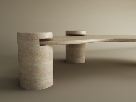 The Wavy Travertine Coffee Table with Cylindrical Base by TRAVERTABLE features sculptural curves and three thick cylindrical legs, with a gently curved top slotting into two larger legs. Neutral lighting highlights its minimalist, customizable design.