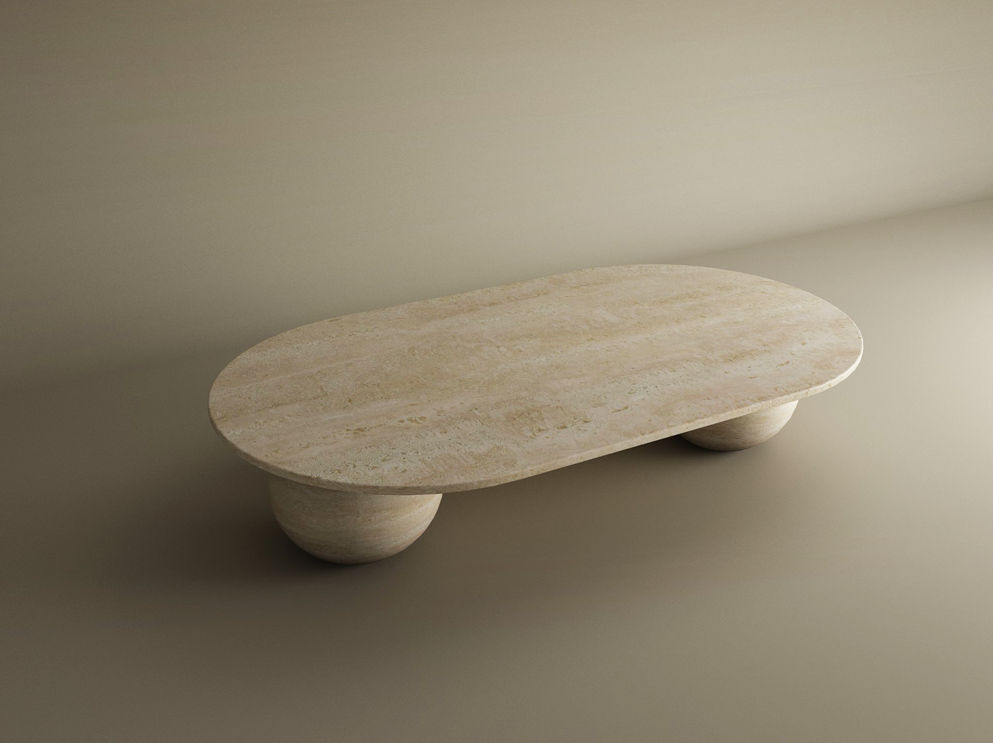 The Oval Travertine Coffee Table with Stone Ball Base by TRAVERTABLE features sculptural craftsmanship and a minimalist design, creating a calm, modern look when placed on a light beige floor with soft, indirect lighting.