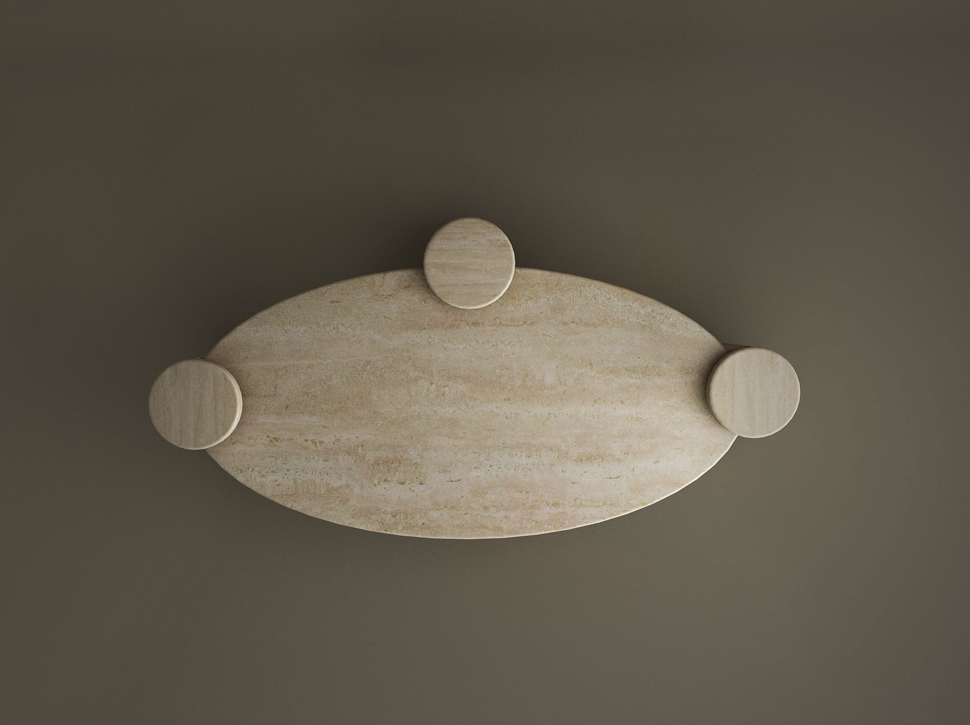 The TRAVERTABLE Ellipse Travertine Coffee Table features a soft organic form with three cylindrical bases, shown in light beige travertine displaying smooth texture and subtle natural veining against a dark taupe background.