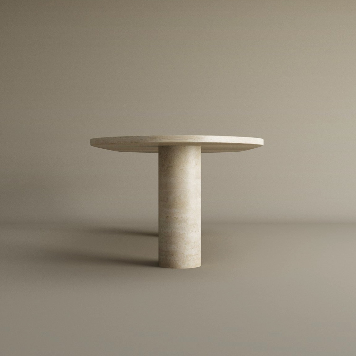 The TRAVERTABLE Oval Travertine Coffee Table features a solid cylindrical base and natural stone veining, offering a minimalist, modern look. Shown against a plain beige background. Customizable design.