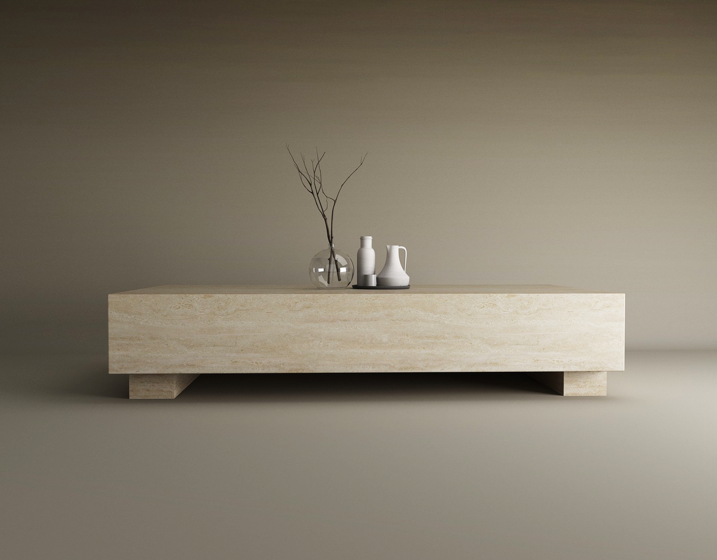 A TRAVERTABLE Rectangular Travertine Coffee Table with Hidden Base stands on a smooth floor. A clear glass vase with bare branches and two white ceramic vessels rest on top, while the plain background complements the calm, neutral vibe.