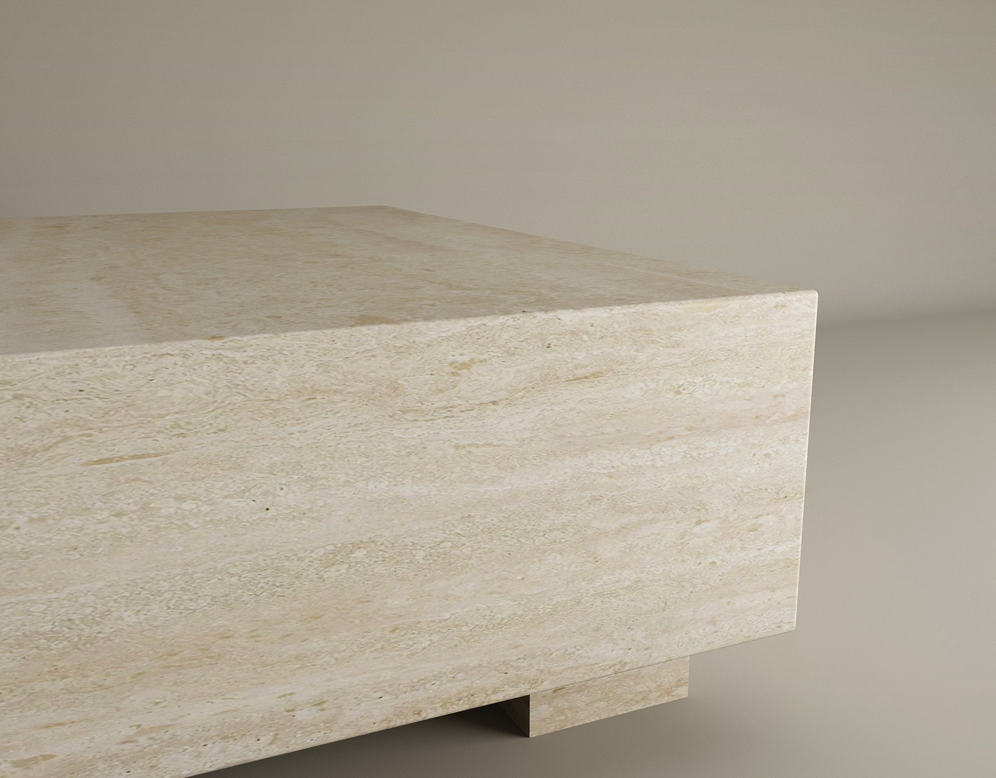 A close-up of the Rectangular Travertine Coffee Table by TRAVERTABLE highlights its smooth, hand-finished travertine surface and subtle natural patterns against a plain background, showcasing its balanced modern design.