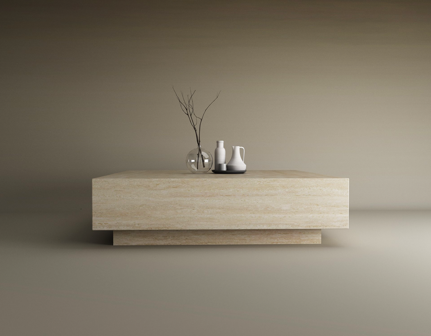 A minimalist scene features the TRAVERTABLE Square Travertine Coffee Table with Hidden Base, showcasing smooth surfaces. Atop sit a clear glass vase with bare branches and two white ceramic vessels, all against a neutral taupe background.