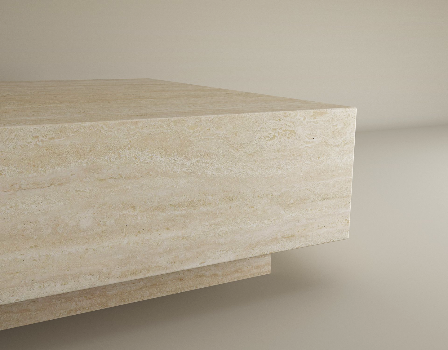 A close-up of the TRAVERTABLE Square Travertine Coffee Table with Hidden Base showcases its hand-finished surface, natural patterns, and minimalist elegance—an understated, customizable piece set against a plain background.