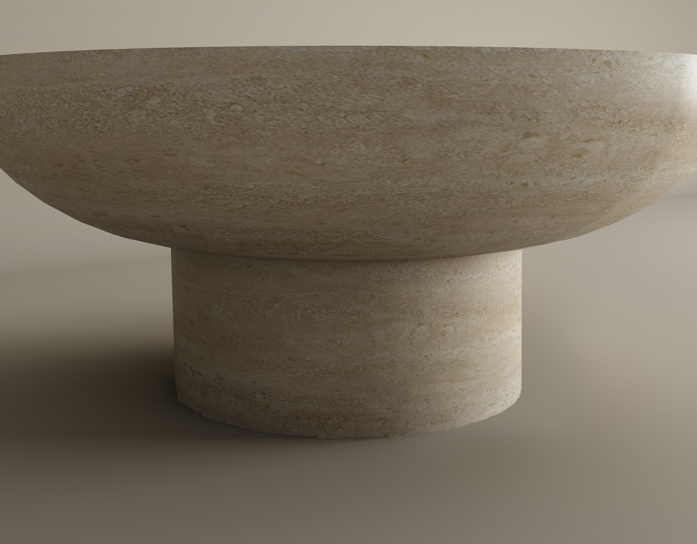 The TRAVERTABLE Round Travertine Coffee Table features a smooth, rounded top and solid cylindrical base in pure travertine stone. Its natural texture and minimalist design suit any modern space. Customizable to fit your decor.