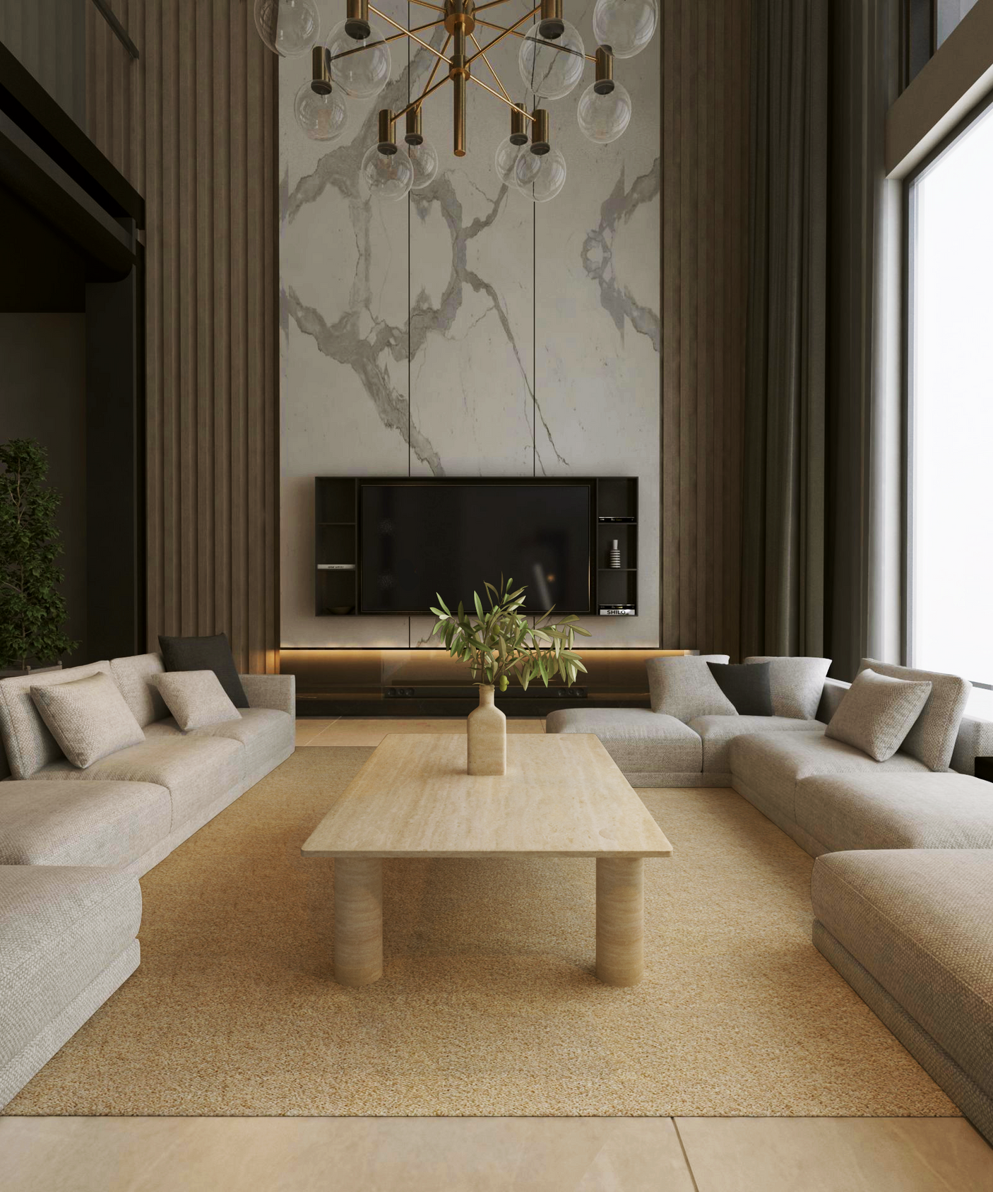 A modern living room with beige sofas around the TRAVERTABLE Rectangular Travertine Coffee Table with Solid Cylindrical Base, a tall marble accent wall, wall-mounted TV, minimal decor, and a large window filling the space with natural light.