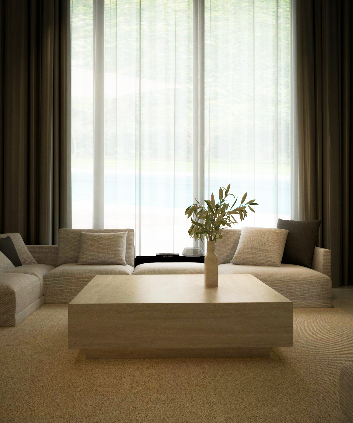 A modern living room with beige sofas, a TRAVERTABLE Square Travertine Coffee Table with Hidden Base, and a vase of green branches. Sheer curtains cover large windows, filling the space with daylight and minimalist sophistication.