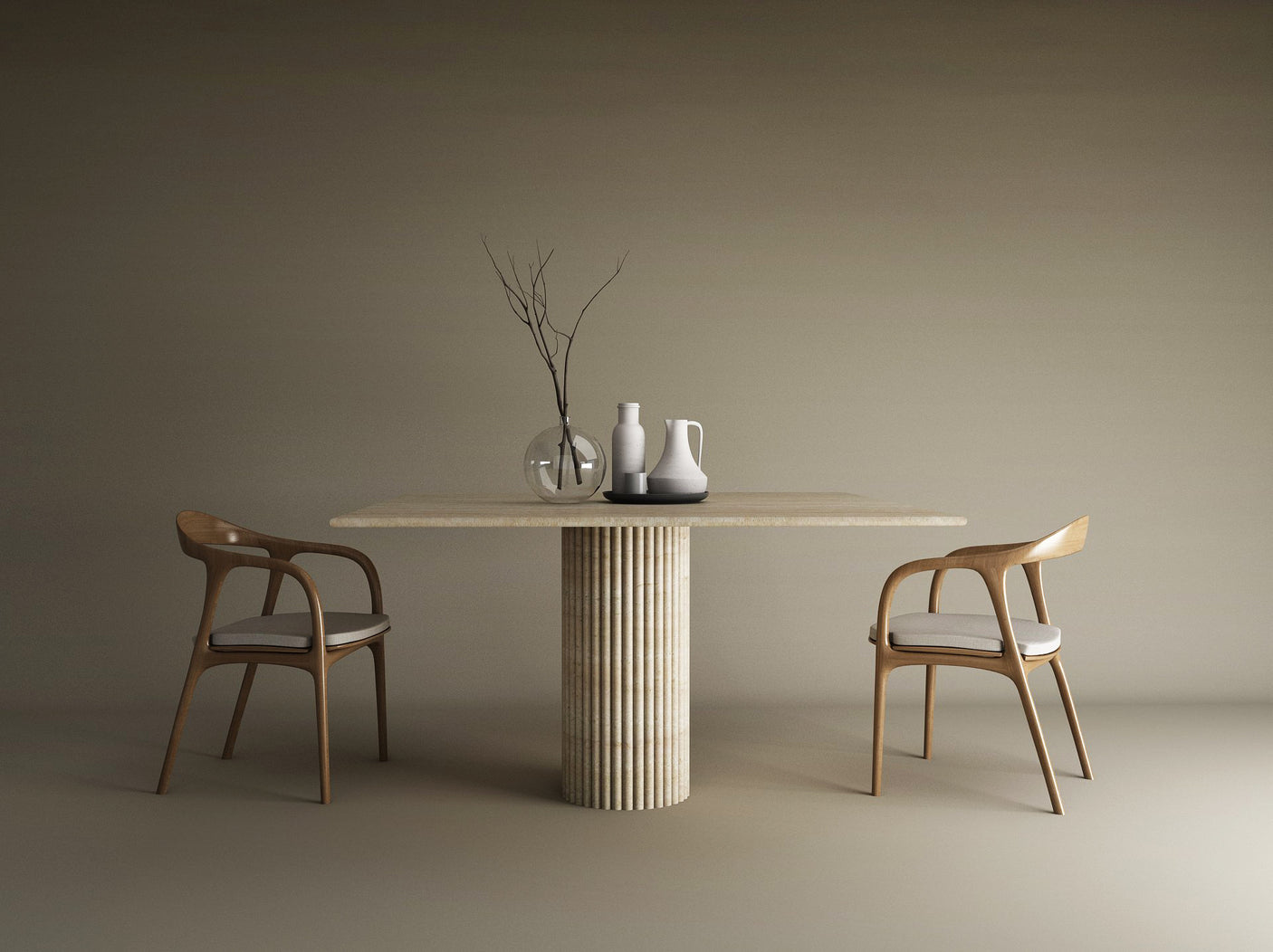 A minimalist dining setup features the TRAVERTABLE Square Travertine Dining Table with a fluted round center base, two cushioned wooden chairs, and vases with a branch as a centerpiece, all set against a neutral beige background.