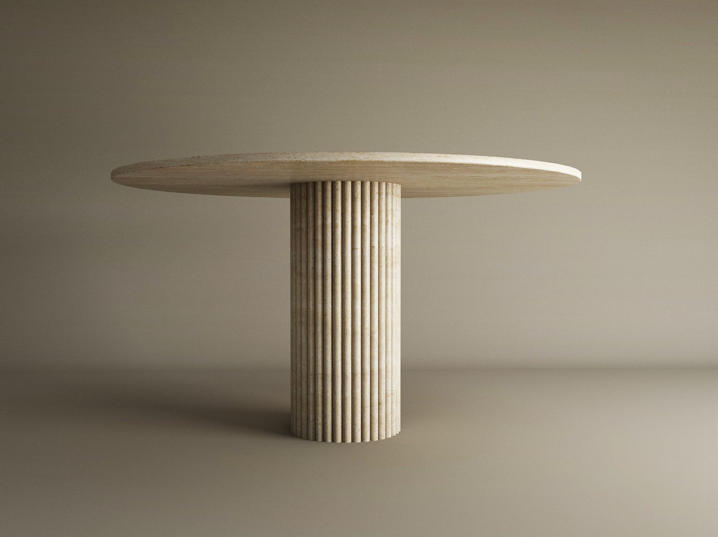 The TRAVERTABLE Oval Travertine Dining Table features a solid travertine stone top and a thick, fluted round center base, offering customizable options and modern, organic elegance to any space.