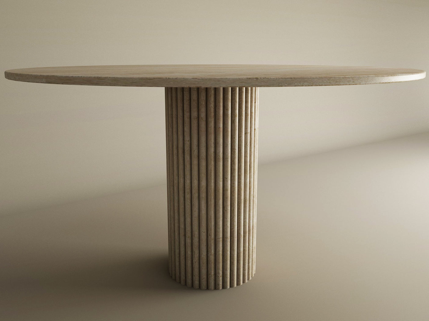 The TRAVERTABLE Oval Travertine Dining Table features a solid travertine stone top and a fluted round center base, exuding natural elegance against a neutral background. This customizable dining table blends timeless style with modern sophistication.