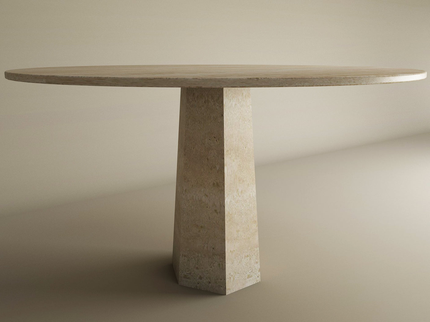 The TRAVERTABLE Oval Travertine Dining Table features a customizable travertine stone top and a wide rockcone center base, set against a neutral background.