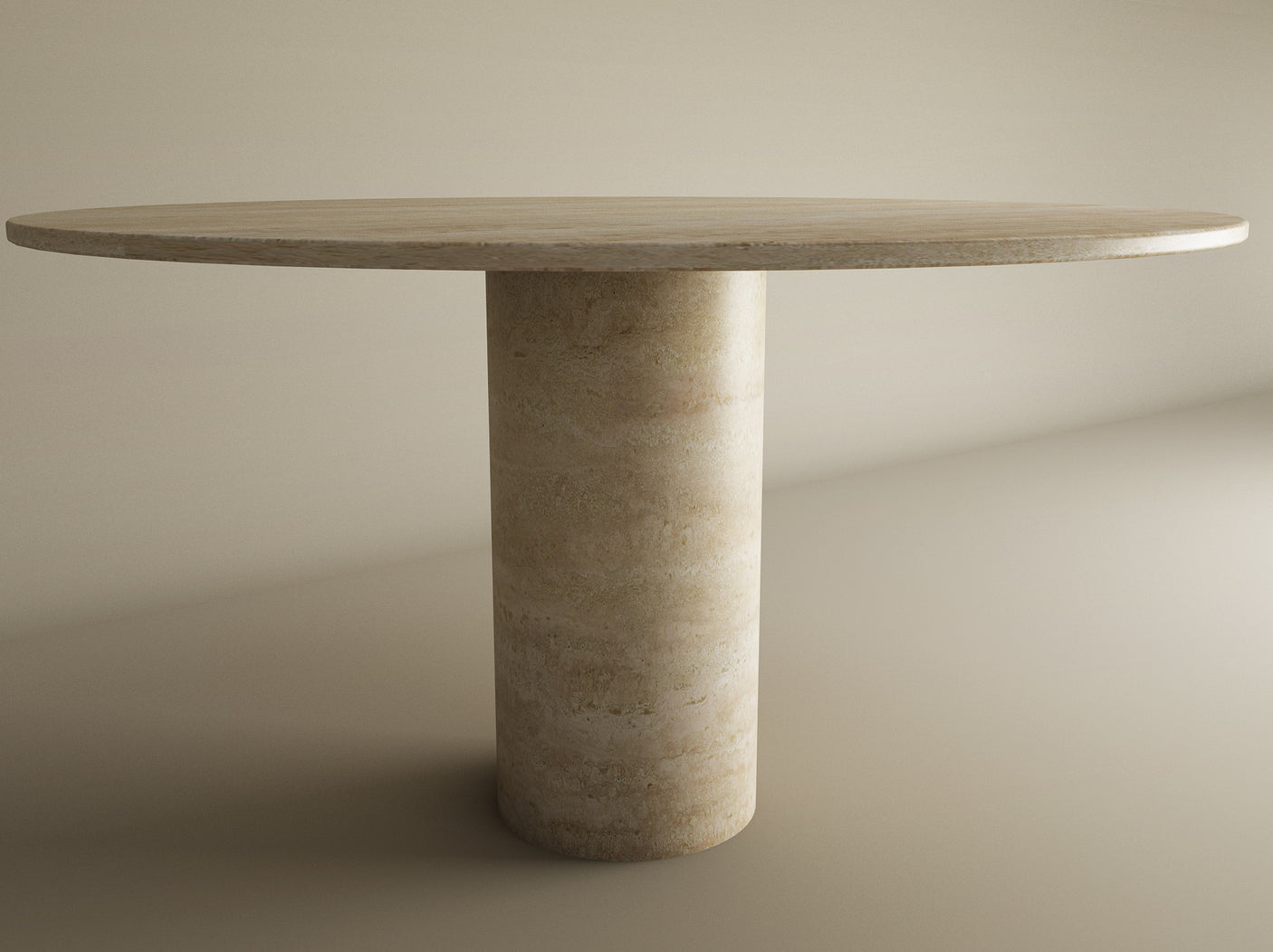 The TRAVERTABLE Oval Travertine Dining Table features a pure travertine stone top and a thick cylindrical center base, creating an elegant focal point in a softly lit, neutral dining space. Customizable to suit your style.