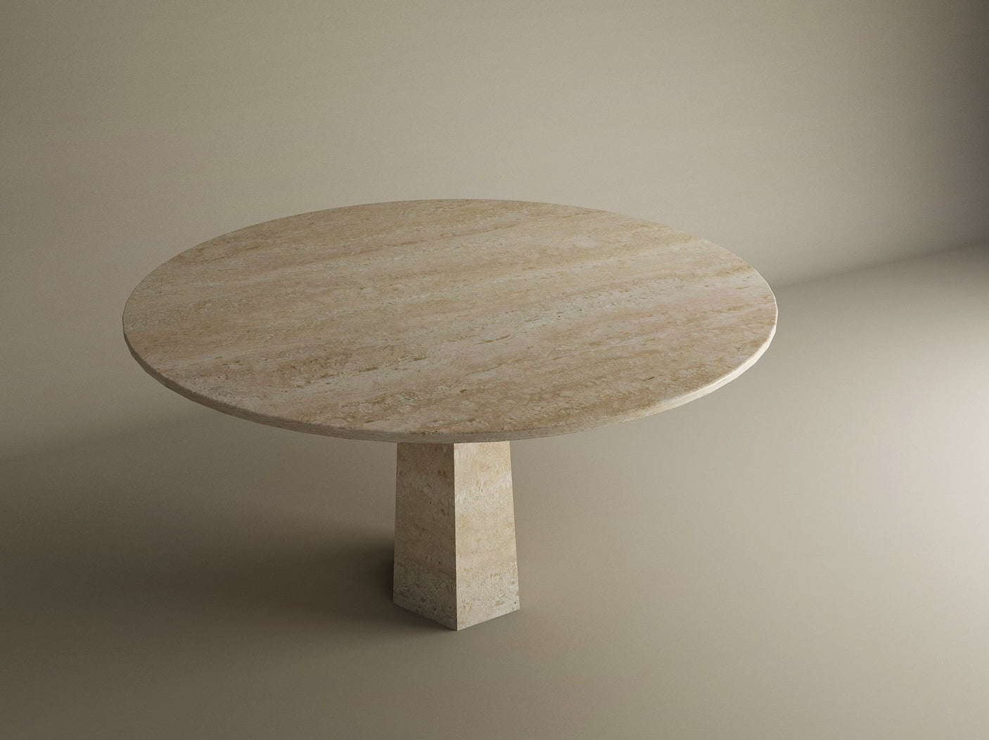 The TRAVERTABLE Oval Travertine Dining Table features a smooth travertine stone top and a distinctive rockcone center pedestal base, shown against a plain beige background. Customizable to suit your dining space.