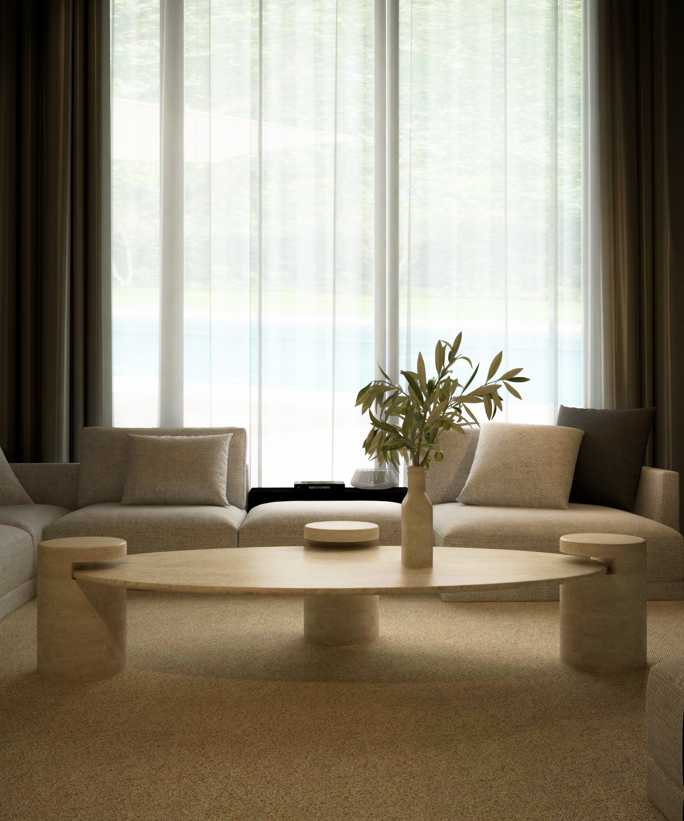 A modern living room with light beige sofas and a TRAVERTABLE Ellipse Travertine Coffee Table with Cylindrical Base. Sheer curtains cover tall windows, letting in natural light and revealing greenery and a pool outside.