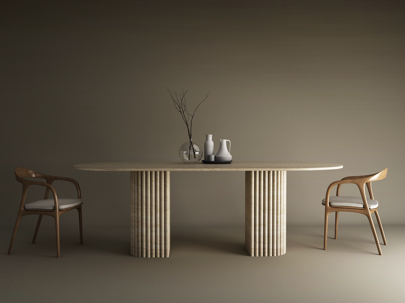 The TRAVERTABLE Oval Travertine Dining Table features a fluted round solid stone base and customizable options. Positioned between wooden chairs with white cushions, it displays minimalist vases and a branch on its heirloom-quality surface.