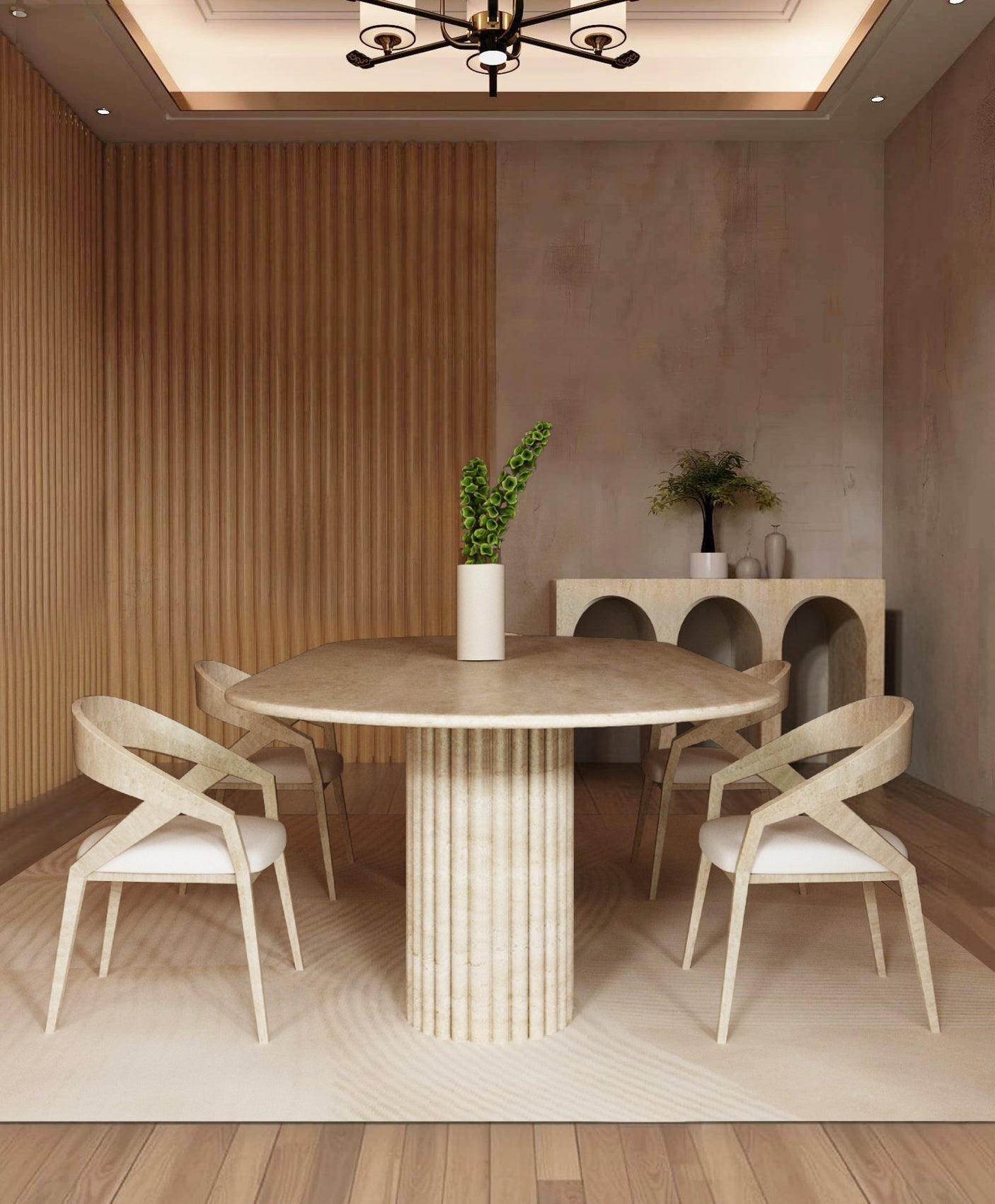 A modern dining room featuring the TRAVERTABLE Oval Travertine Dining Table with Fluted Round Base, four light wood chairs with white seats, a tall vase with green leaves, and a sideboard with vases and greenery against a wood-paneled wall.