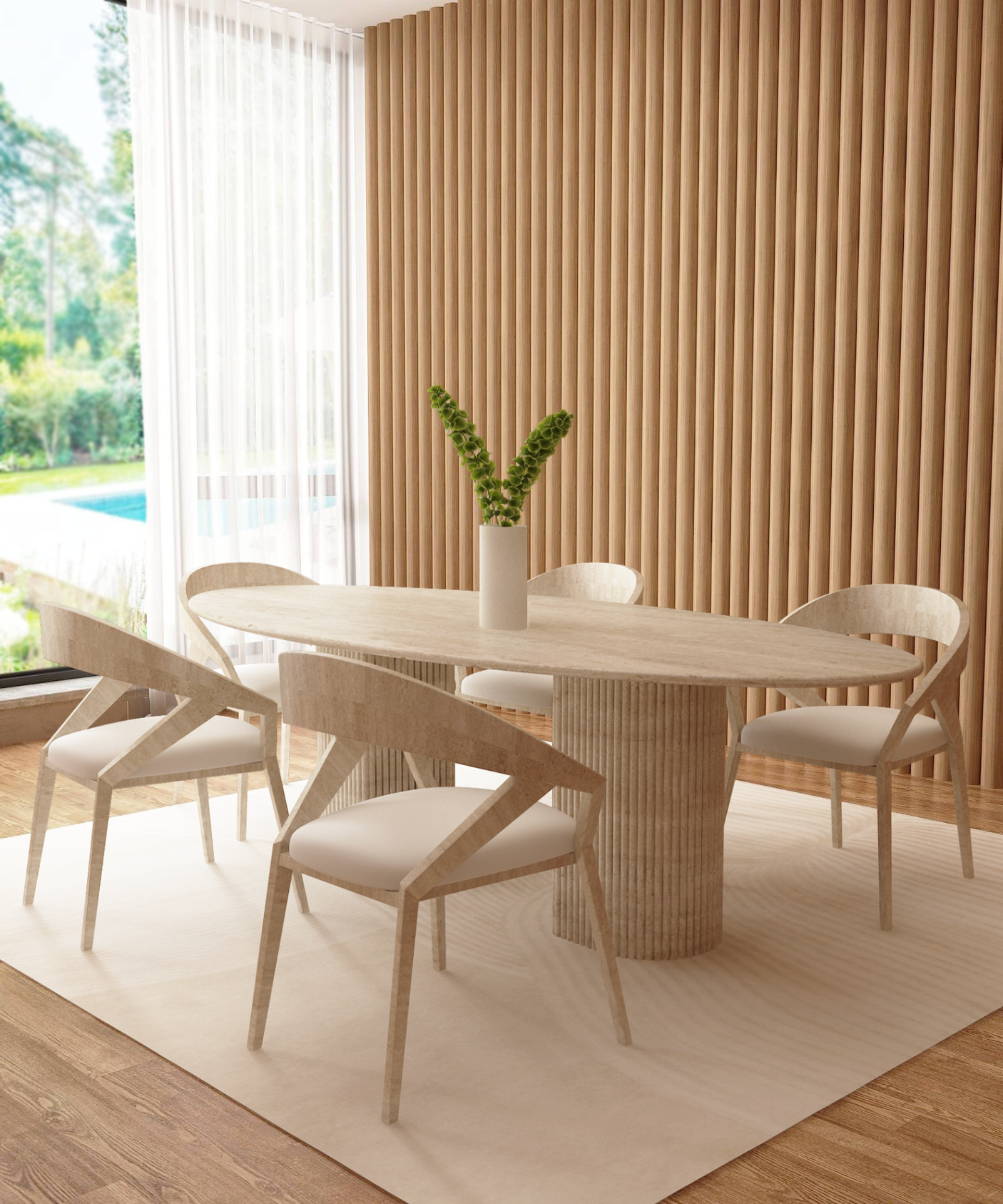 A modern dining room showcases the TRAVERTABLE Ellips Travertine Dining Table with a fluted round solid stone base, four chairs, a white rug, vertical wood panels, and a vase with greenery. Large windows frame sunny views of greenery and a pool.