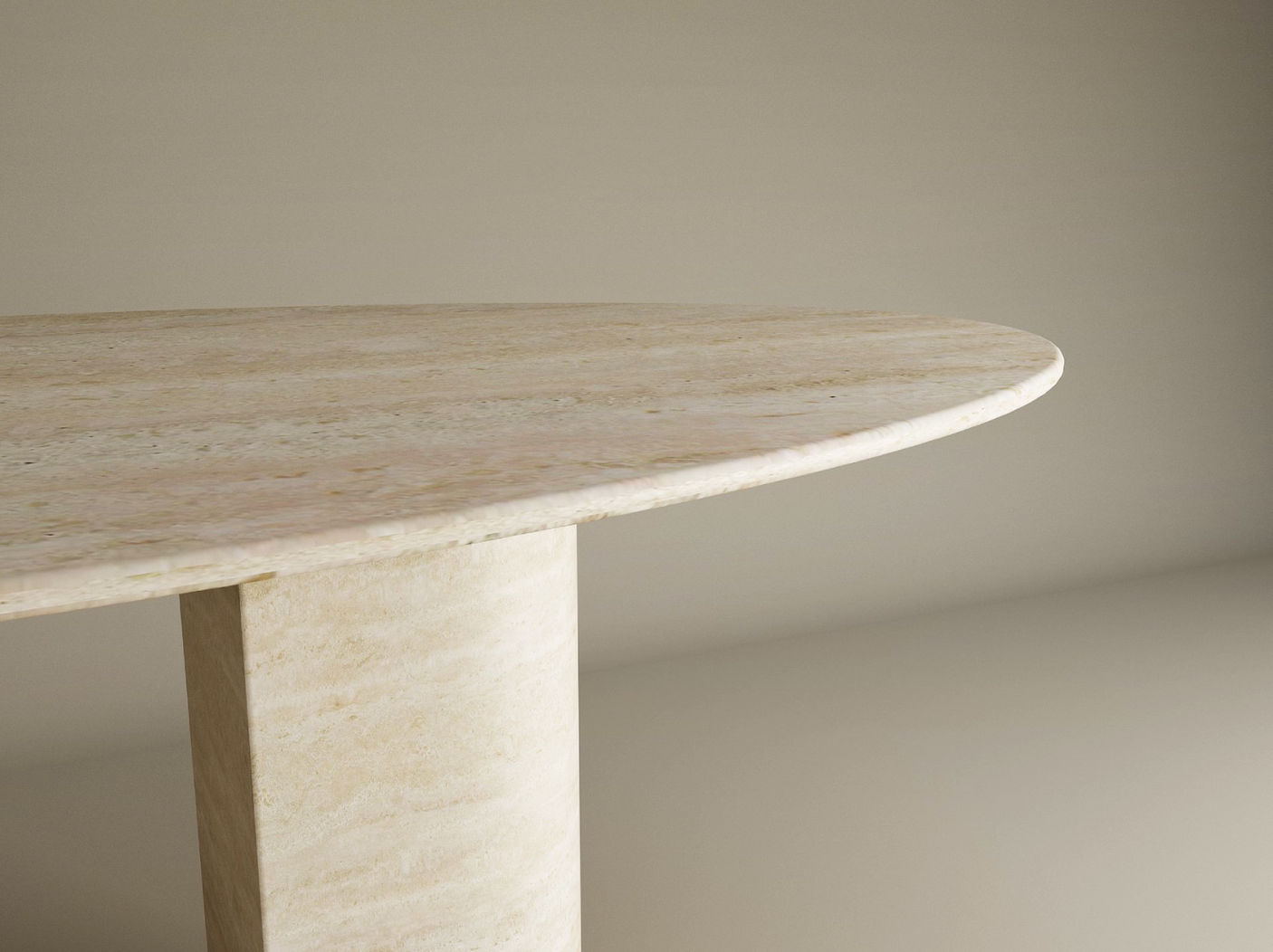 Close-up of the TRAVERTABLE Ellips Travertine Dining Table, a minimalist oval design with a sloped natural stone pedestal base and customizable options, set against a softly lit neutral background.