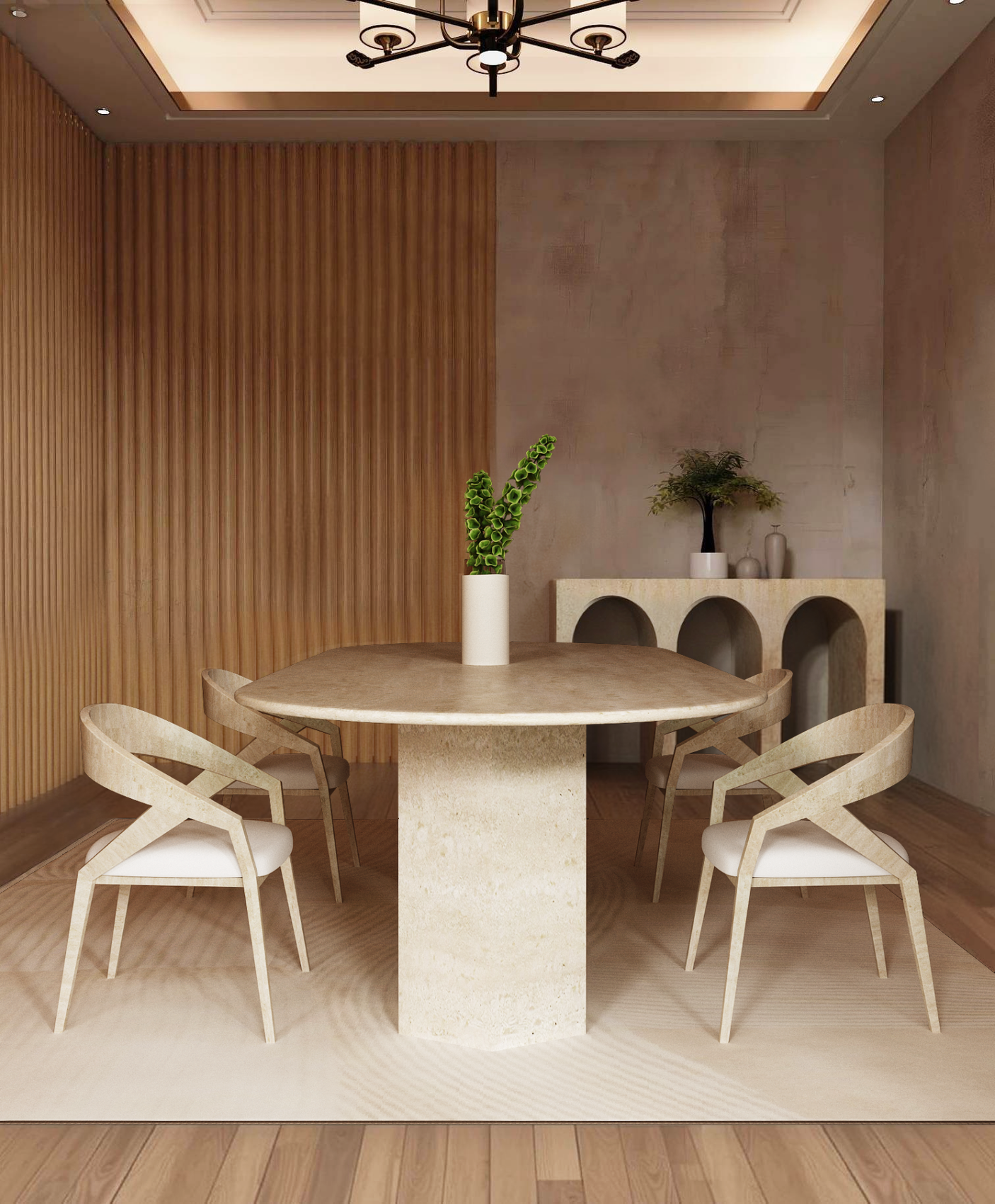 A minimalist dining room with the TRAVERTABLE Oval Travertine Dining Table featuring an organic stone hexagonal pedestal base, four beige chairs, a white vase with green leaves, a decorated sideboard, wood panel walls, and a modern ceiling light.