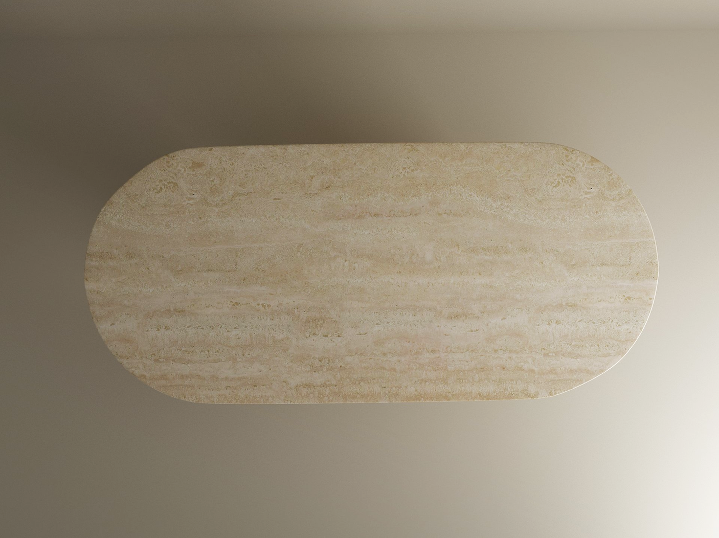 A top-down view of the TRAVERTABLE Oval Travertine Dining Table featuring a smooth, light beige solid travertine stone tabletop and a tapered round base, set against a neutral background.