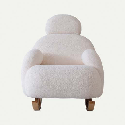 The Cloud Plush Rocking Chair and Ottoman by Travertable offers ergonomic armrests, soft white textured upholstery, a cushioned backrest for comfort, wooden rockers for a timeless vibe, and is elegantly set against a simple white background to showcase its modern design.