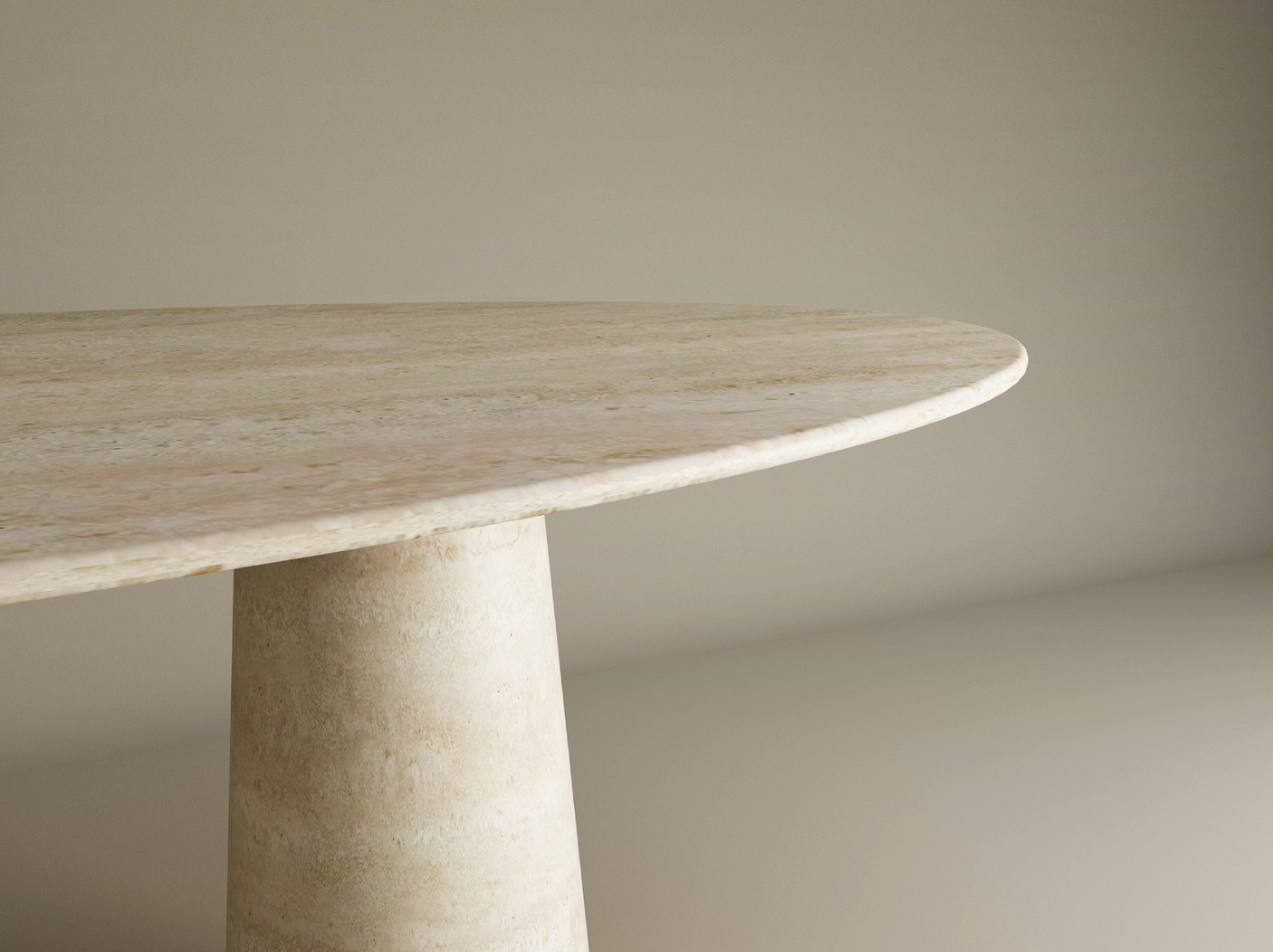 A close-up of the TRAVERTABLE Ellips Travertine Dining Table features a round top and conical pedestal base in organic travertine stone, set against a light background. The table is fully customizable for your dining space.