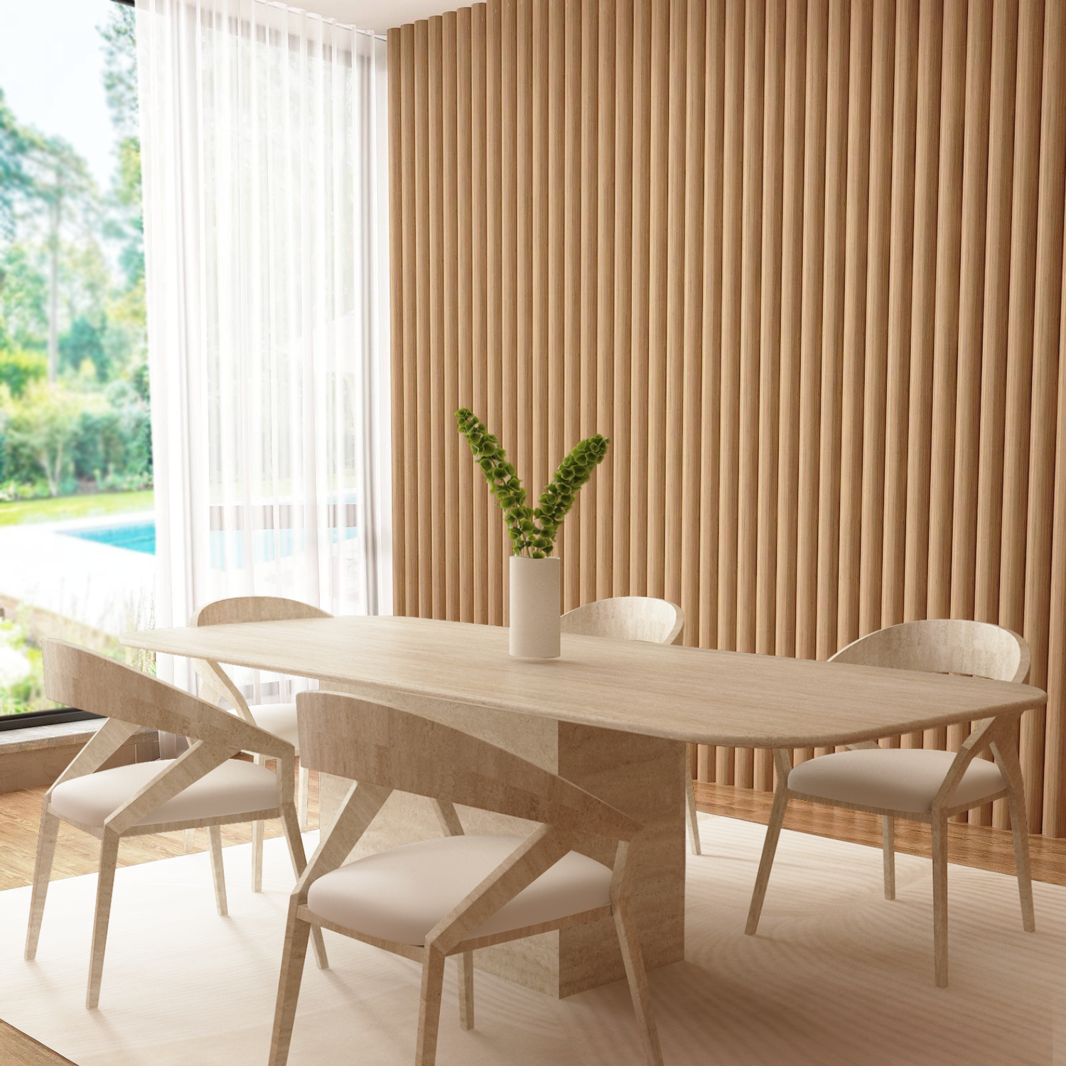 A modern dining room features the TRAVERTABLE Rectangular Travertine Dining Table with a natural stone base, four white chairs, a white vase with green foliage, vertical wooden slats on the wall, and large windows overlooking a garden and pool.