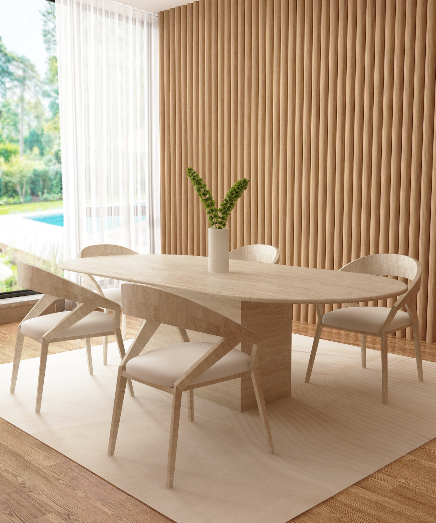 A modern dining room features the TRAVERTABLE Oval Travertine Dining Table with Block Base, four matching chairs, a white vase with green flowers, wood panel walls, light wood floor, sheer curtains framing a view of trees and a pool.