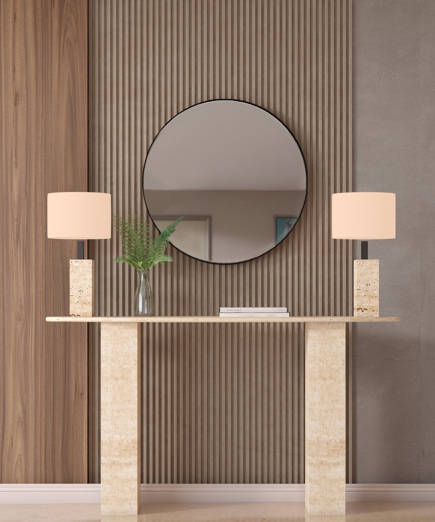 A TRAVERTABLE Ellips Travertine Console Table with Rectangular Pedestal Base displays a glass vase with green ferns and two lamps with square beige shades. A round mirror on a grooved wood accent wall adds sculptural elegance to the scene.
