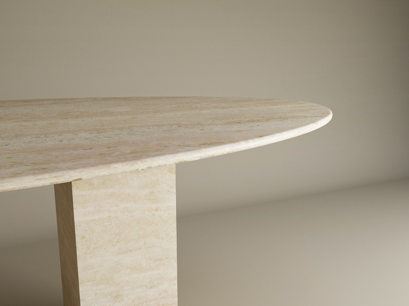 Close-up of the TRAVERTABLE Ellips Travertine Dining Table with a textured beige travertine stone top and thick rectangular pedestal base, set against a plain background. Soft lighting highlights its smooth, elegant customizable design.