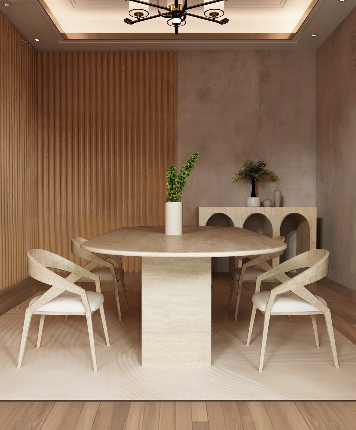 A modern dining room featuring the TRAVERTABLE Oval Travertine Dining Table with a rectangular pedestal base, four matching chairs, a tall vase with green stems, light wood sideboard with decor, wood paneling on the left wall, and a ceiling light above.